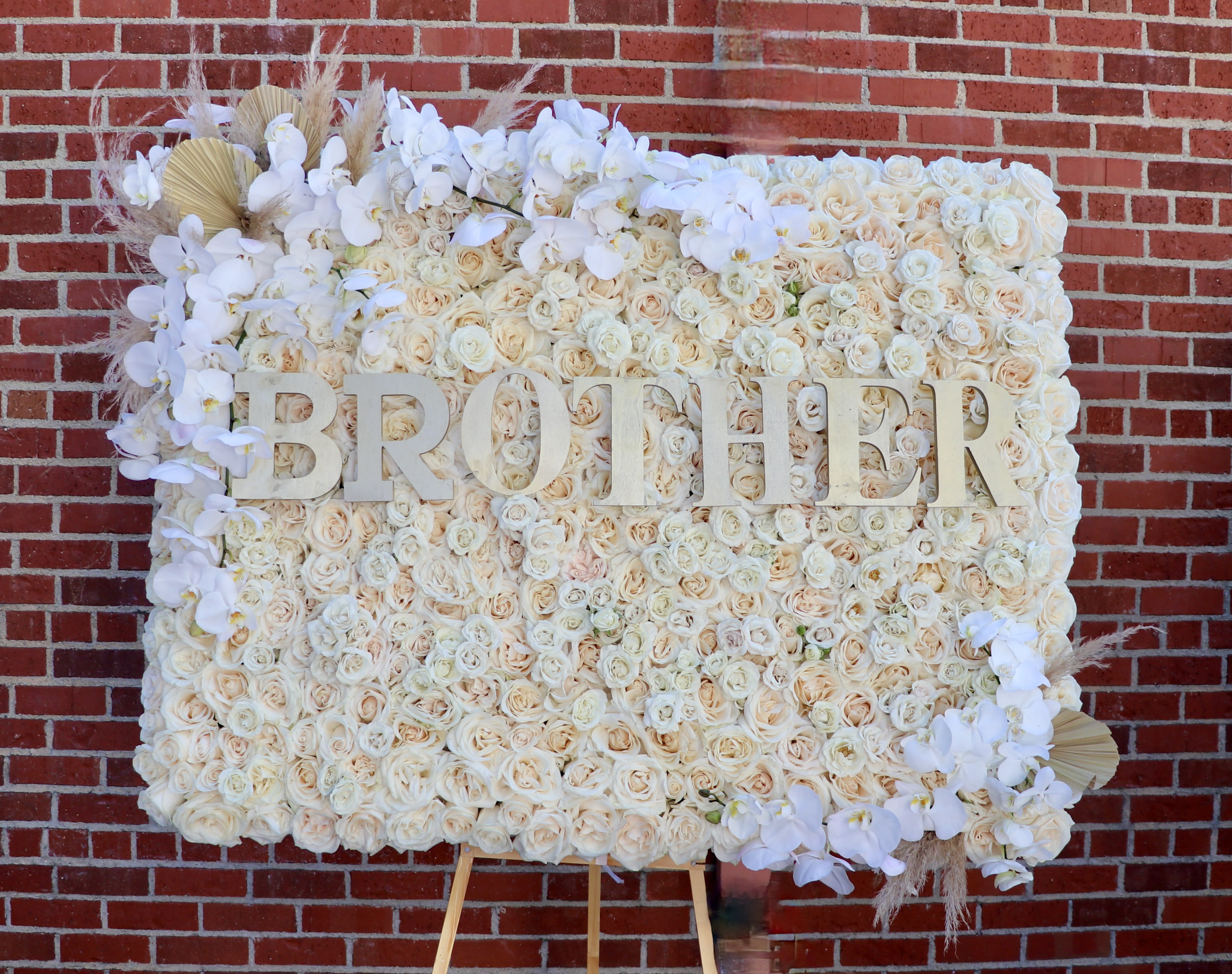 Rose Board  - This frame is covered in roses and accented with orchids and other florals along with a loved one's name or custom lettering.   Standard: 2'x3' Deluxe: 3'x3' Premium: 4'x3'
