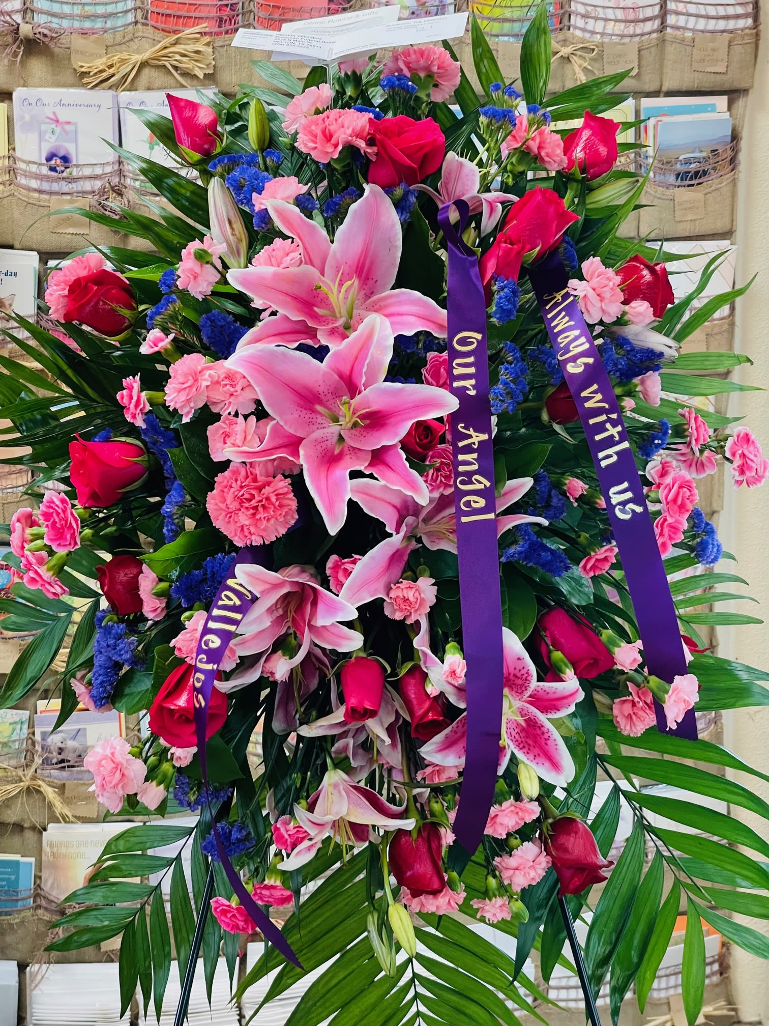 Amethyst Remembrance - This vibrant standing spray shares the warmth and comfort your loved ones need during this difficult time through each blushing bloom. Beautifully combined with vibrant pinks and purples featuring  lilies, spray roses, snapdragons, and assorted greens to express your heartfelt love.