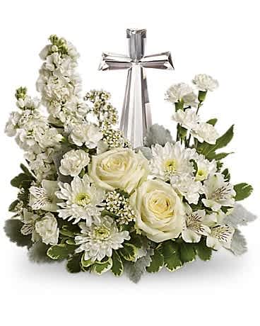 Teleflora's Divine Peace Bouquet - An elegant display of faith and divine peace, this beautiful arrangement will comfort the bereaved in a truly thoughtful and respectful way. An exquisite crystal cross is surrounded by a bed of lovely blossoms. It is sure to be appreciated and always remembered. A fragrant mix of pure white blooms - including roses, alstroemeria, stock, carnations and waxflower - is accented with dusty miller and variegated pittosporum around an exclusive Crystal Cross keepsake.
