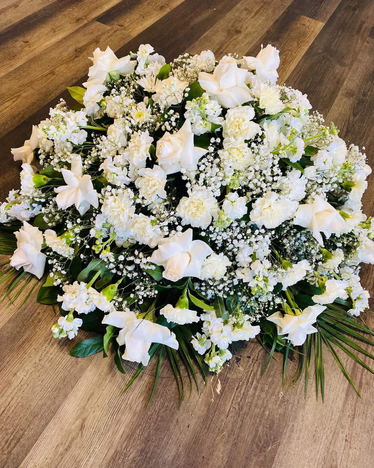 Tranquility Medium White Casket With Mix Flowers Tranquility Medium White Casket With Mix Flowers - Beautiful medium caket whit white roses.