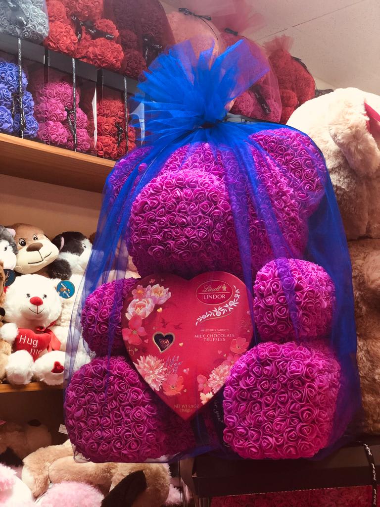 Rose Bear XL - Our largest rose bear is massive and will blow anyone away. Completely covered with foam roses, wrapped with a large box of chocolates. Bear color and candy may vary, contact us today to confirm the available options. 