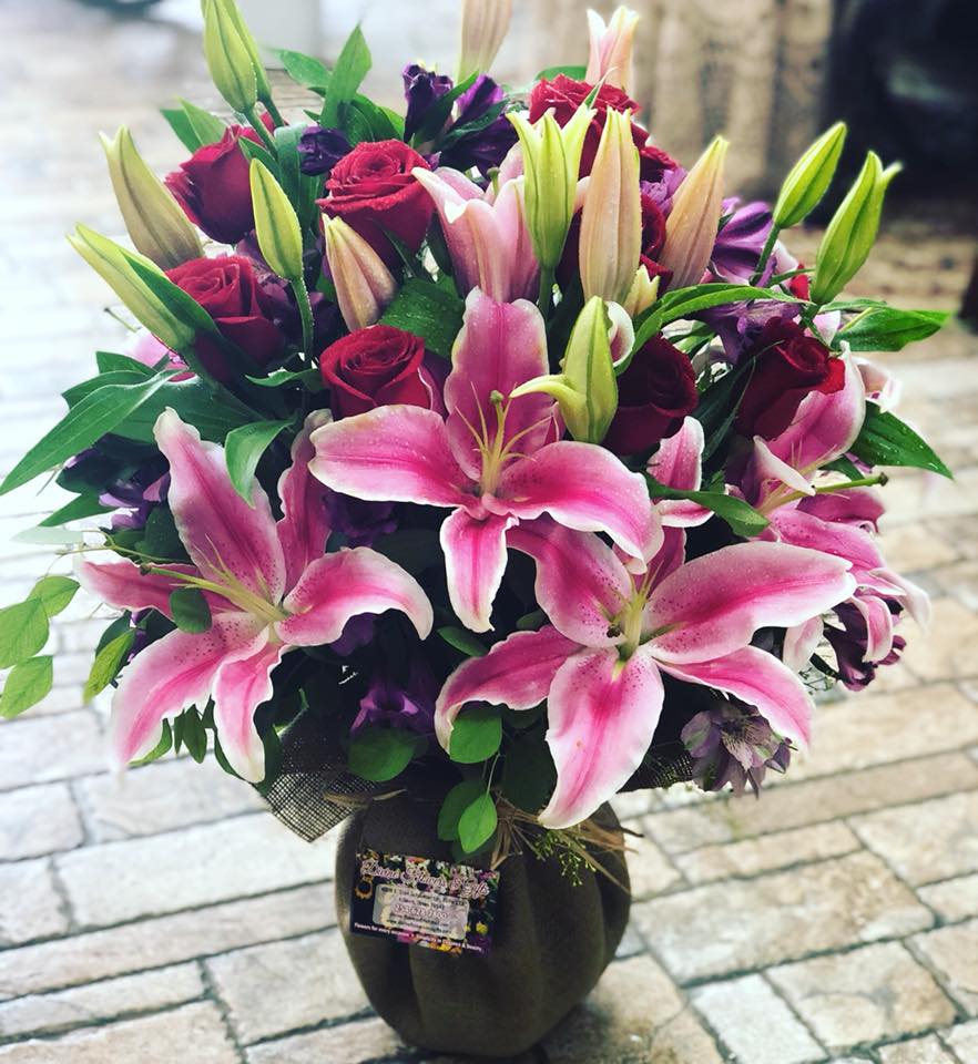 Love Struck Love Struck - A romantic mix of stargazer lilies, red roses, purple accents and assorted greenery. Knock somone's socks off with this stunning bouquet