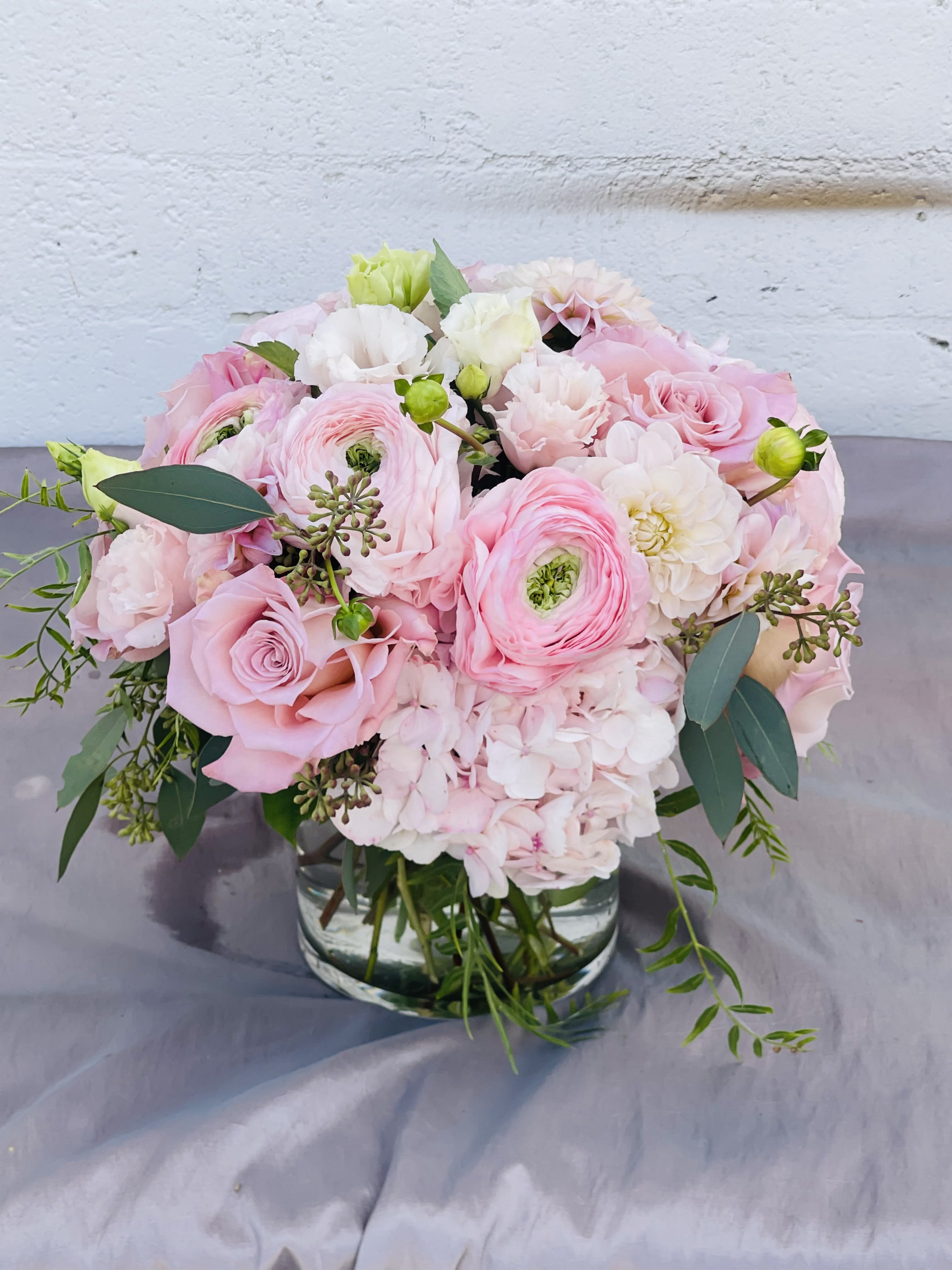 Lush, pale pinks bouquet  - This is a gorgeous arrangement of soft pinks. Arranged in a glass or wooden box. 