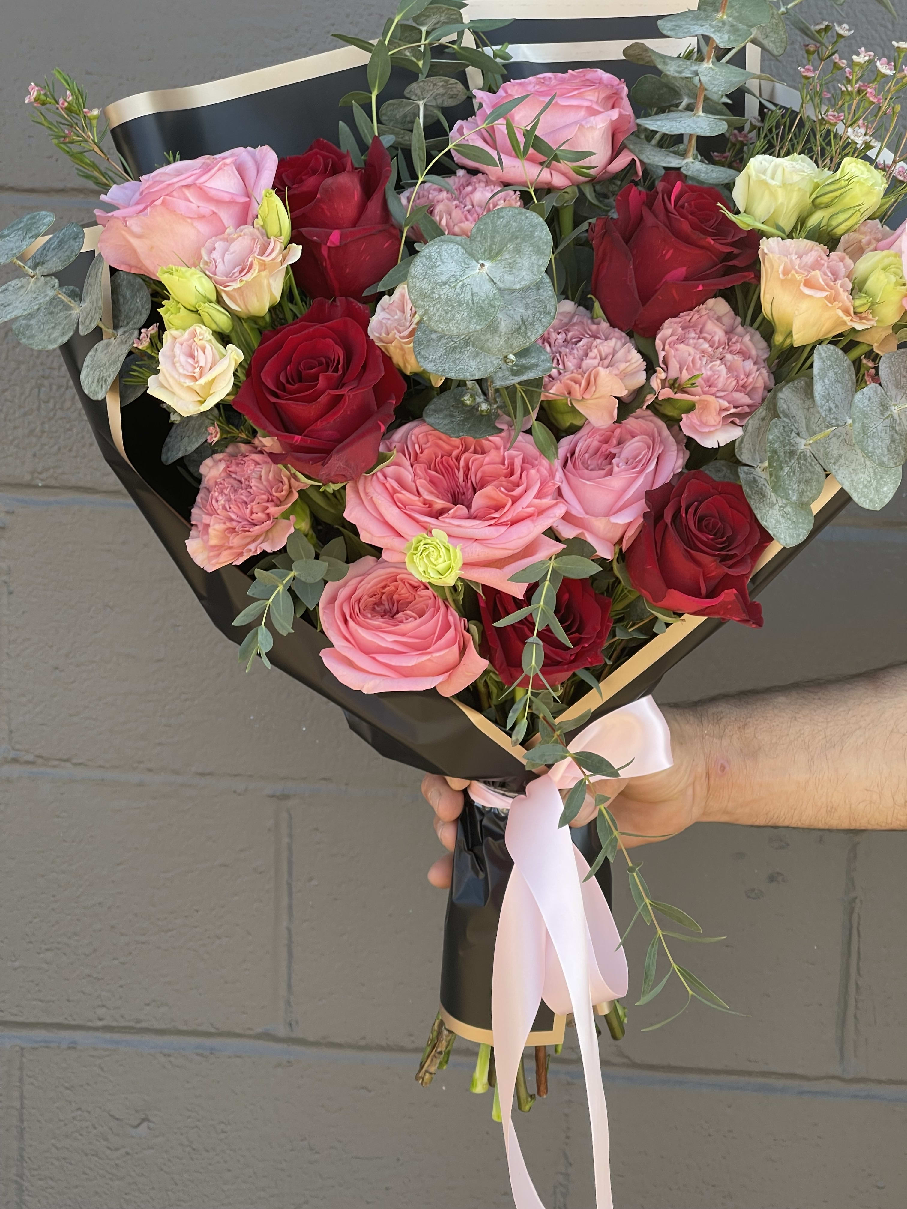 The princess Ari Bouquet  - This bouquet is beautiful and created with beautiful reds, pinks and shaped into a heart ️ making it mesmerizing to the eye 