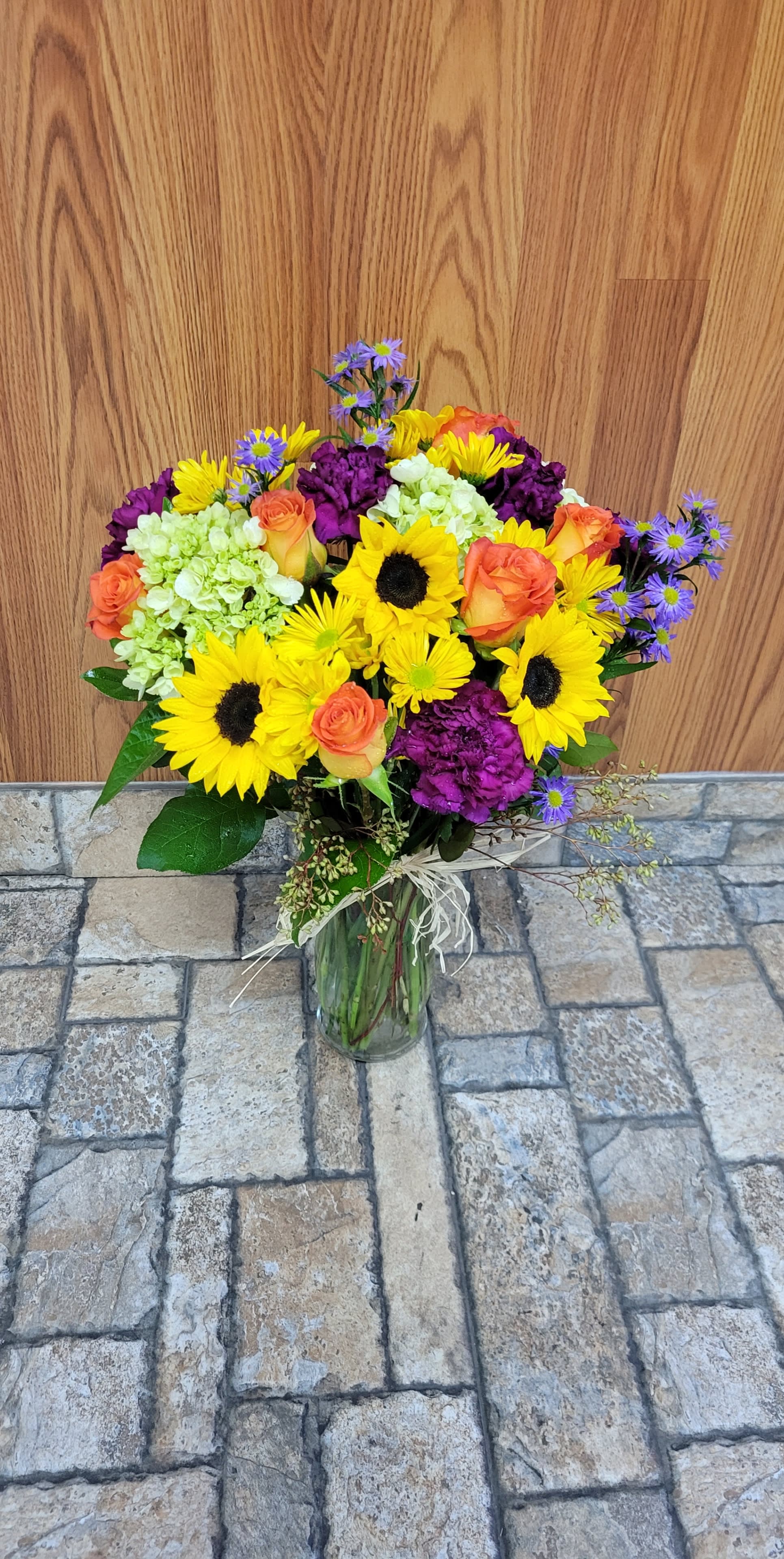 Colorful Love - A beautiful arrangement of purple, yellow, and orange flowers with hints of green and blue tones. 
