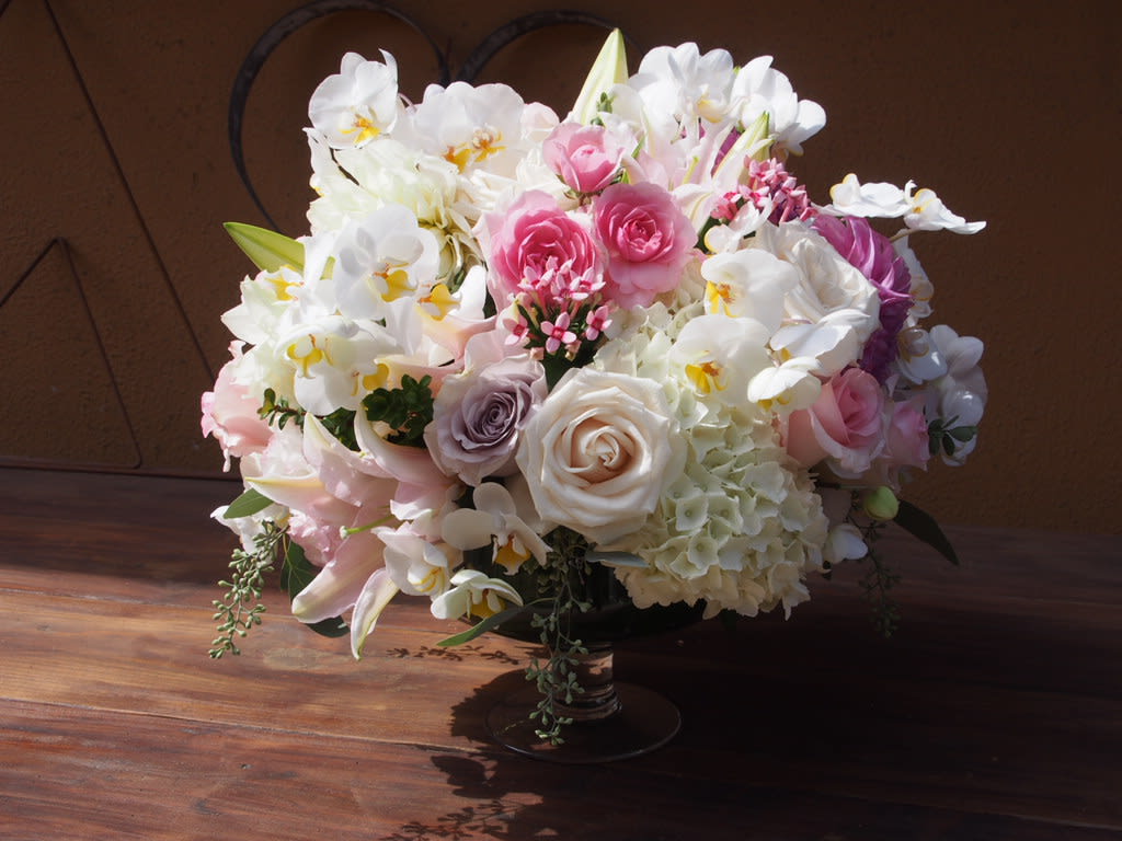 Darling Darling - Clear vase with white, and pastel pinks flowers like roses, spray rose, hydrangeas and orchids.