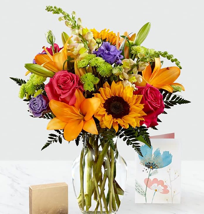 Best Day by FTD - Sunflowers, lilys, roses, carnations, snaps and more in this bright, smile producing end of summer arrangement.