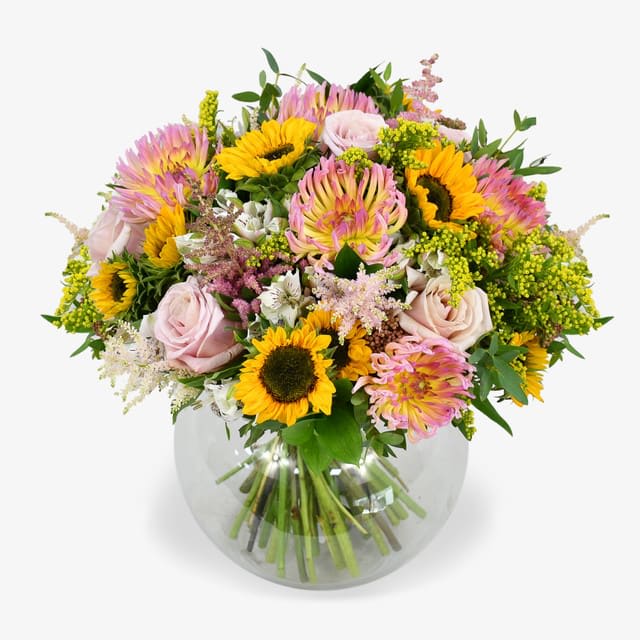 spectacular bouque  - Spidermums and splendid sunflowers are the stars of this spectacular bouquet. Soft and tonal chrysanthemums with their unique shape are complimented with blush roses and fluffy astilbe. A gorgeous colour combination made bolder by bursts of brightly coloured sunflowers. All finished with lush seasonal greenery.