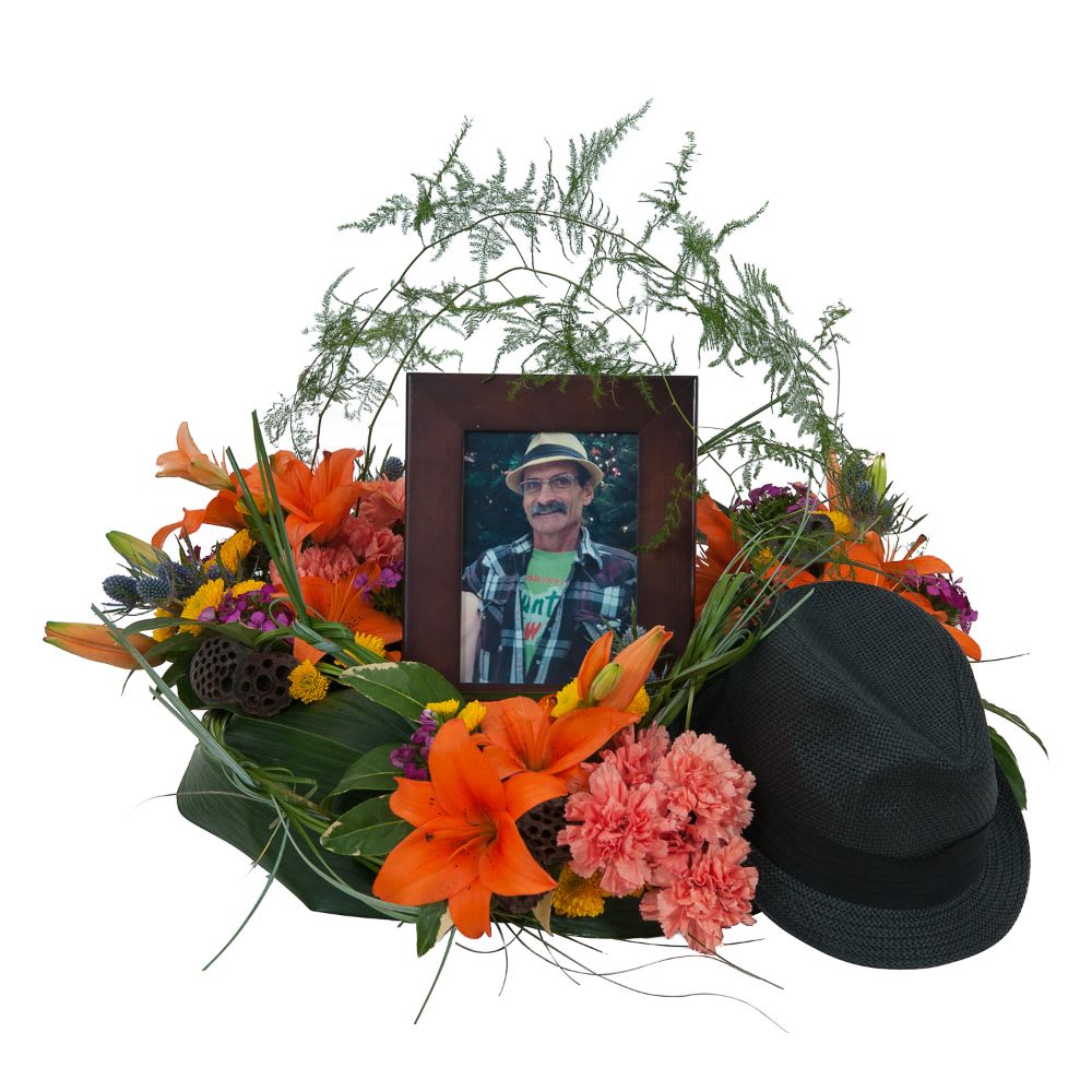 Remembering The Good Times  - Lilies and a variety of bright color blooms add to the personalization of a wildflower look. TMF-802