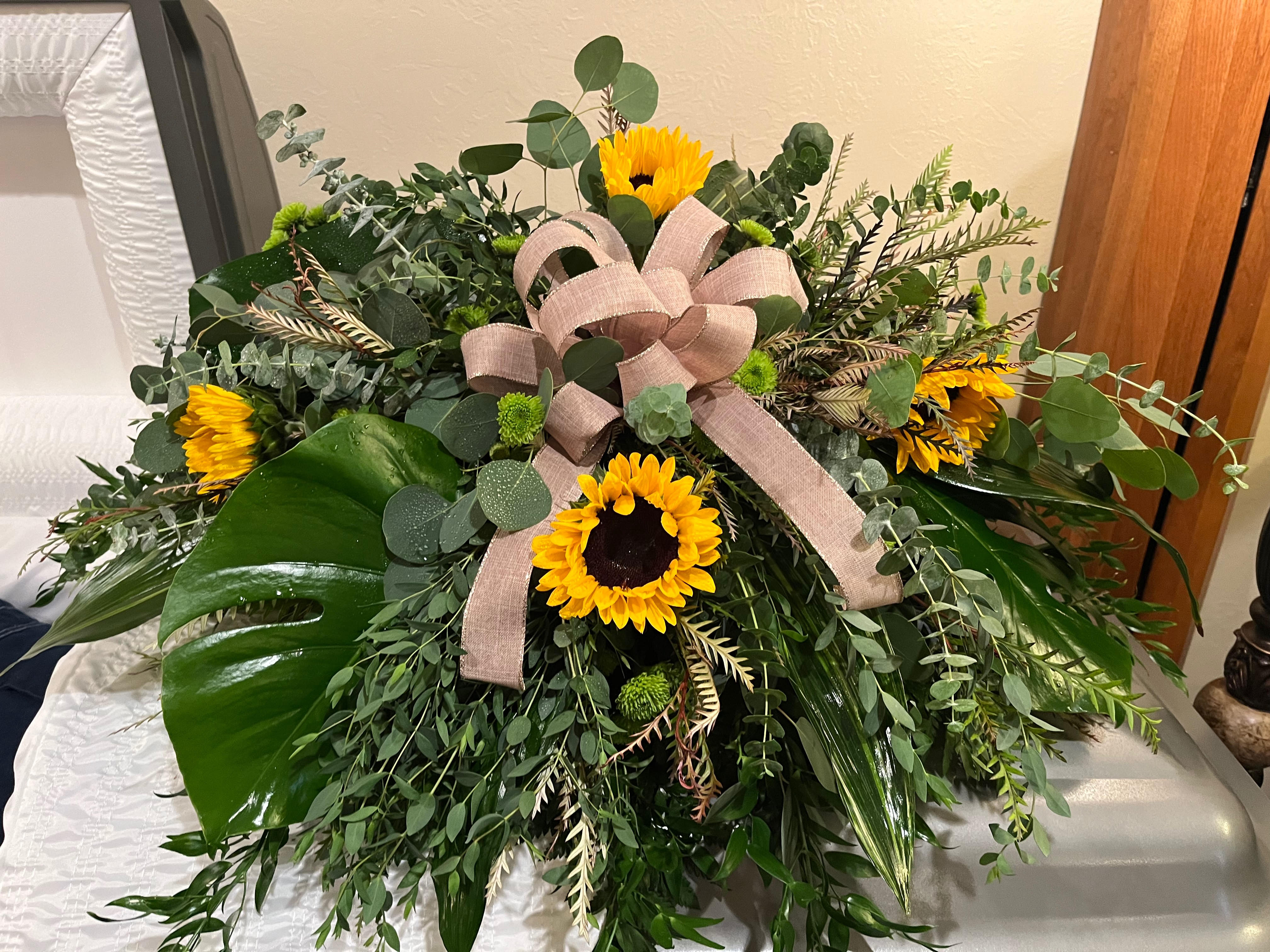 Country Charm - casket piece with assorted greens , sunflowers, green button poms