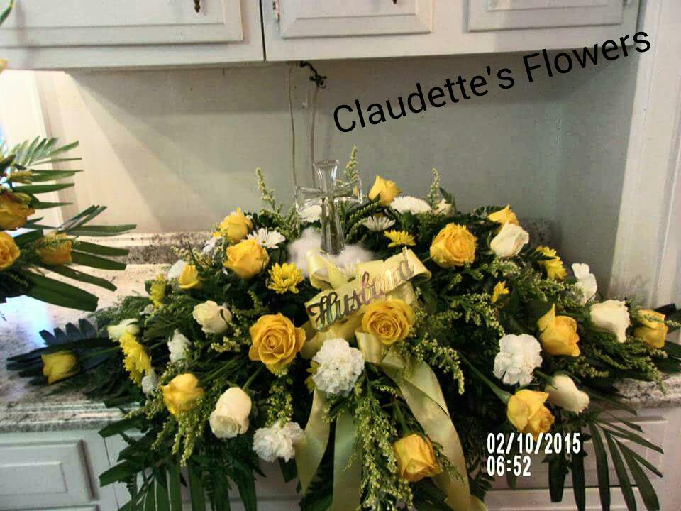 Yellow and white casket spray - Yellow roses and white carnations and a glass cross sit elegently on top of  this casket spray.  