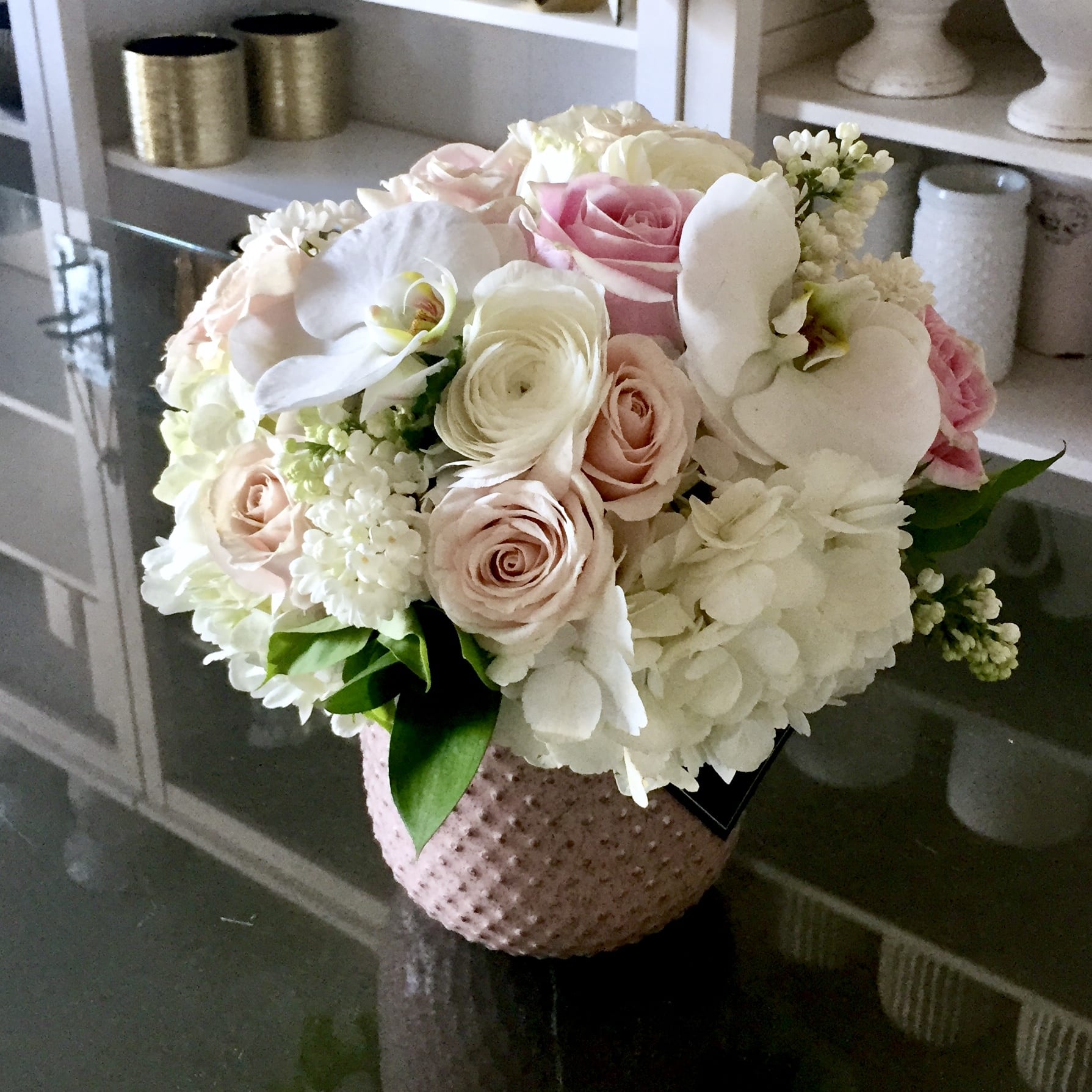 Pretty in Pink - .Beautiful pink ceramic  4&quot;X5&quot; hob nail vase filled with pink and white hydrangeas, light pink roses, spray roses, tube rose, and phalaenopsis orchids.  Arrangement is approx 10&quot;x10&quot; round.