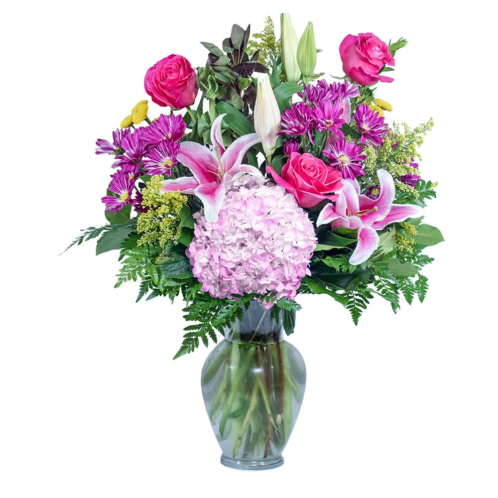 Paint the Town - TMF-1436 - Art inspiring any day of the week. Paint the Town will have them reaching for their canvas and paints. Stargazer lily, hydrangea, and daisies are a few of the awe inspiring flowers accenting this spring garden vase.  Approximately 21&quot;W X 34&quot;H