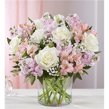 Elegant Blush Arrangment Elegant Blush Arrangment - All-around arrangement with white roses and carnations, pink Peruvian lilies (alstroemeria) and stock; accented with baby’s breath and assorted greenery