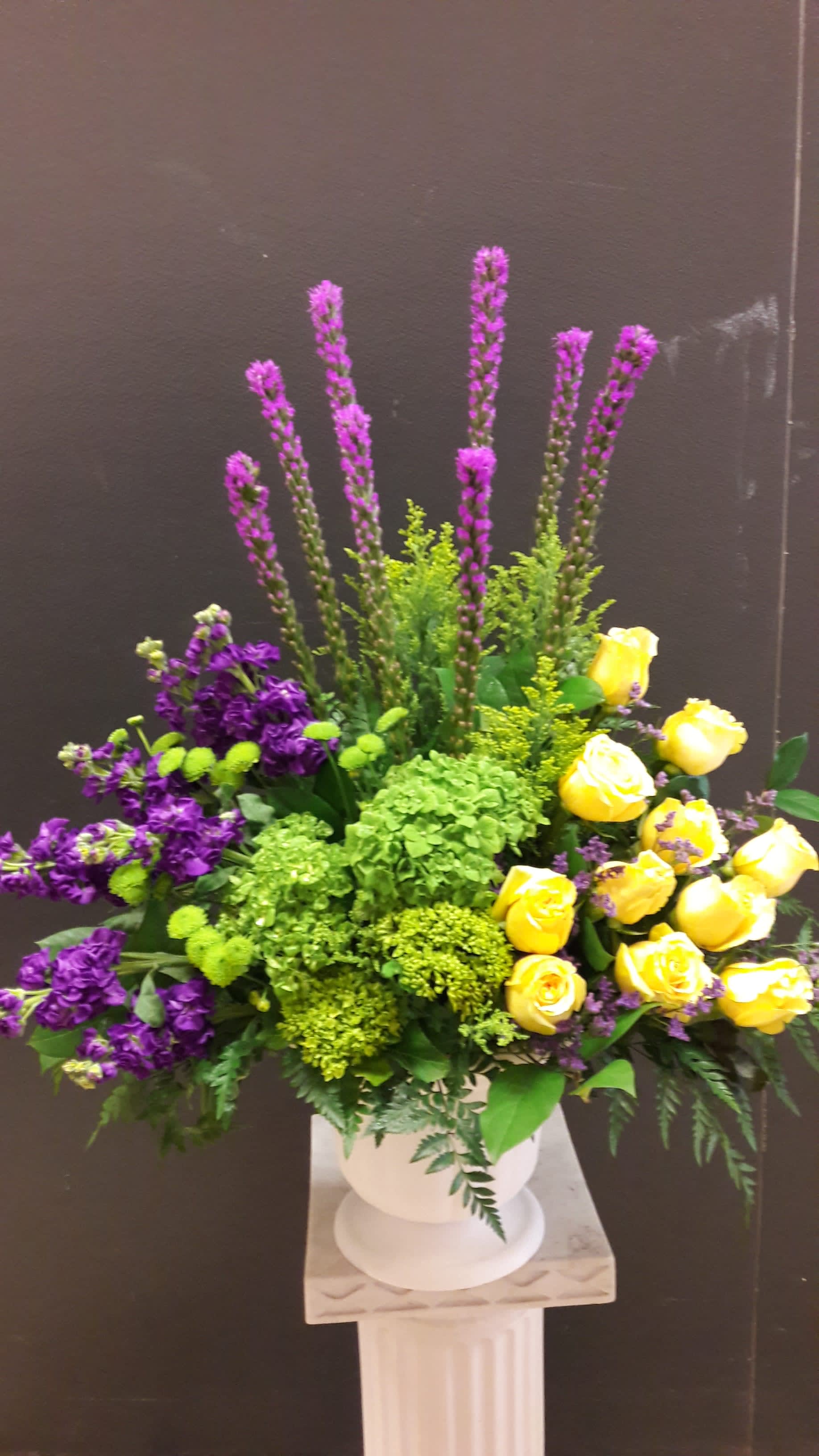 Elegant basket 1 Elegant basket 1 - Made with yellow roses, purple stock. green hydrangeas and liatris