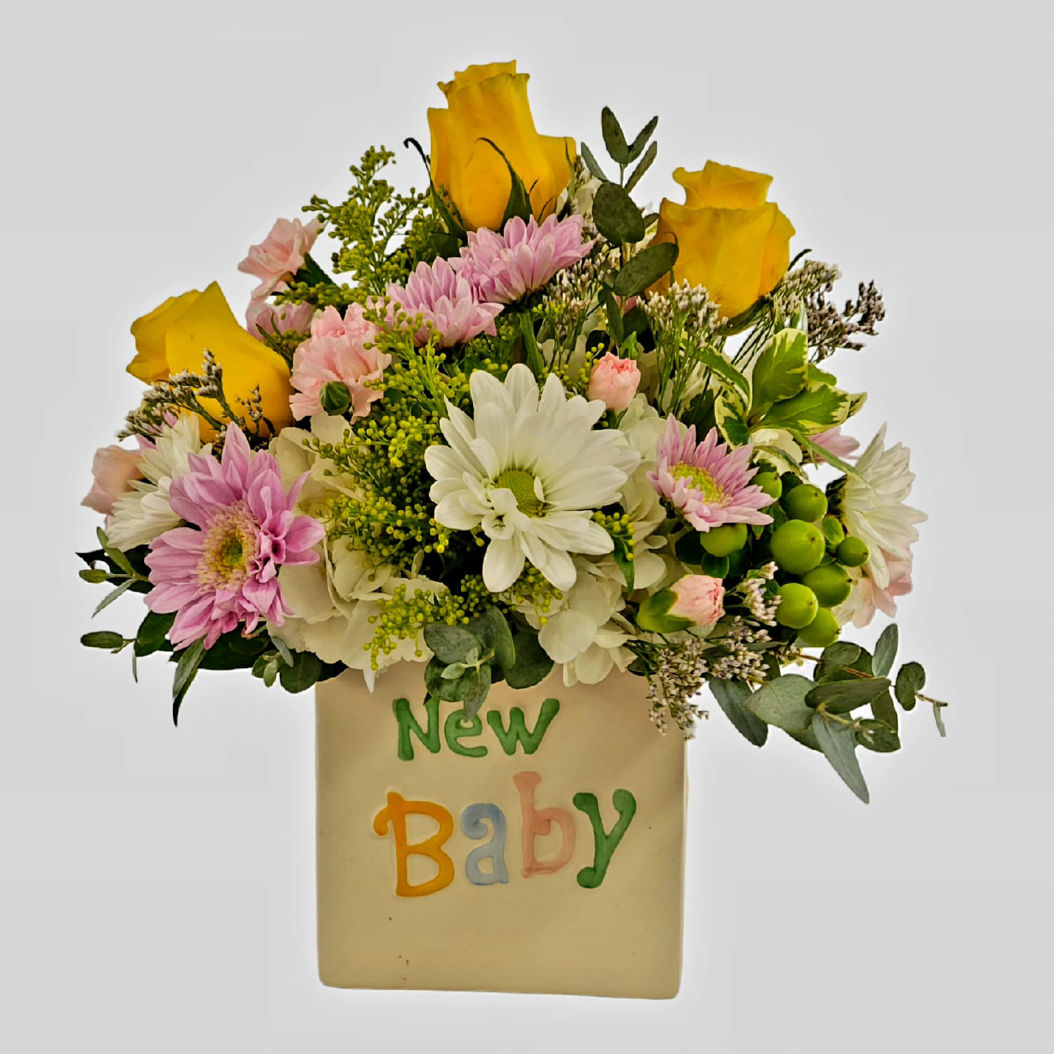 New Baby - The perfect arrangement to send to your loved one for welcoming their new baby! In a keepsake ceramic container is a soft palette of yellow, pink, lavender, white and green.