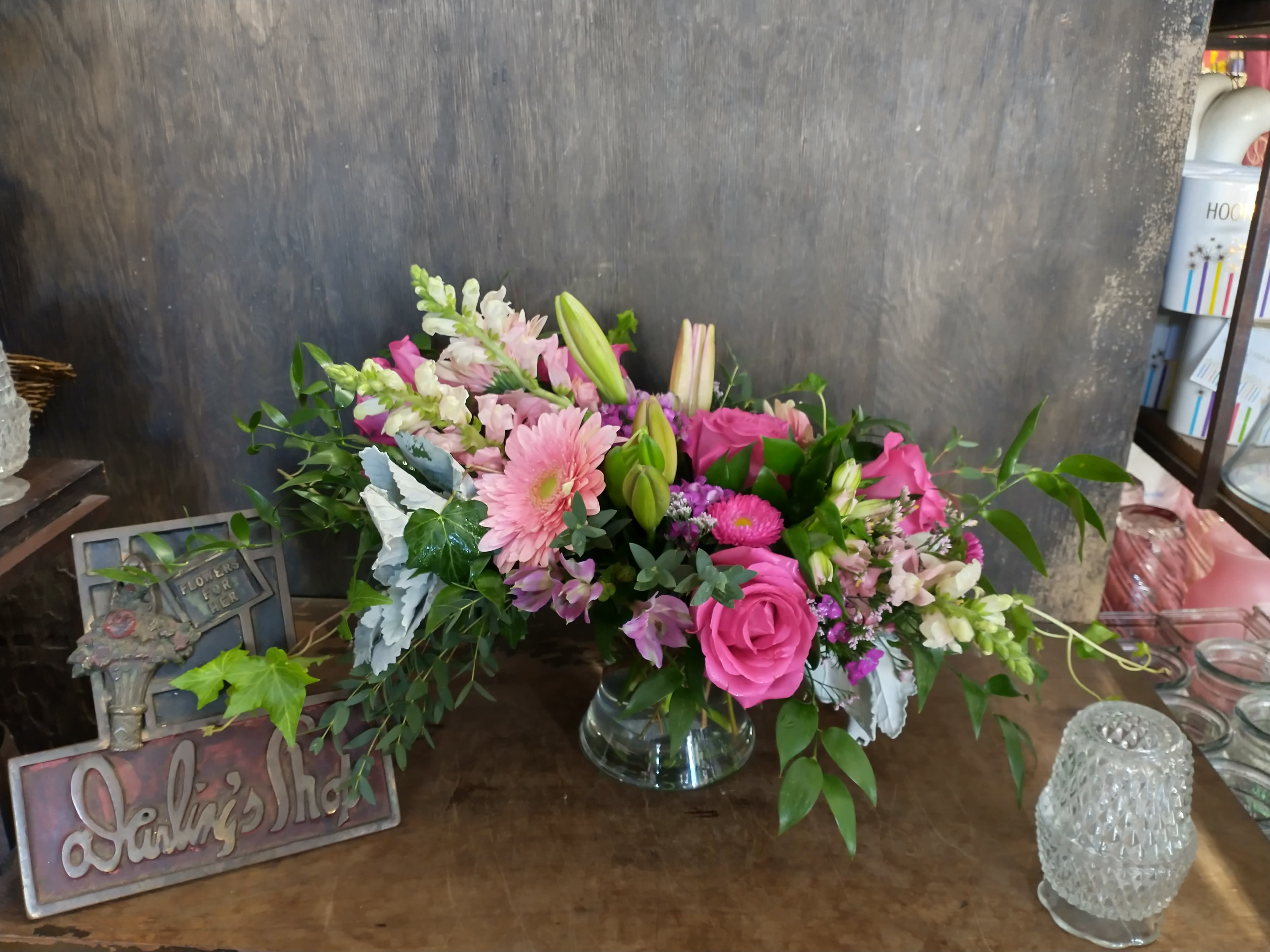 There was you - Lovely assortment of pink flowers, with different textures of greenery. Give us a call. Colors can be changed. 