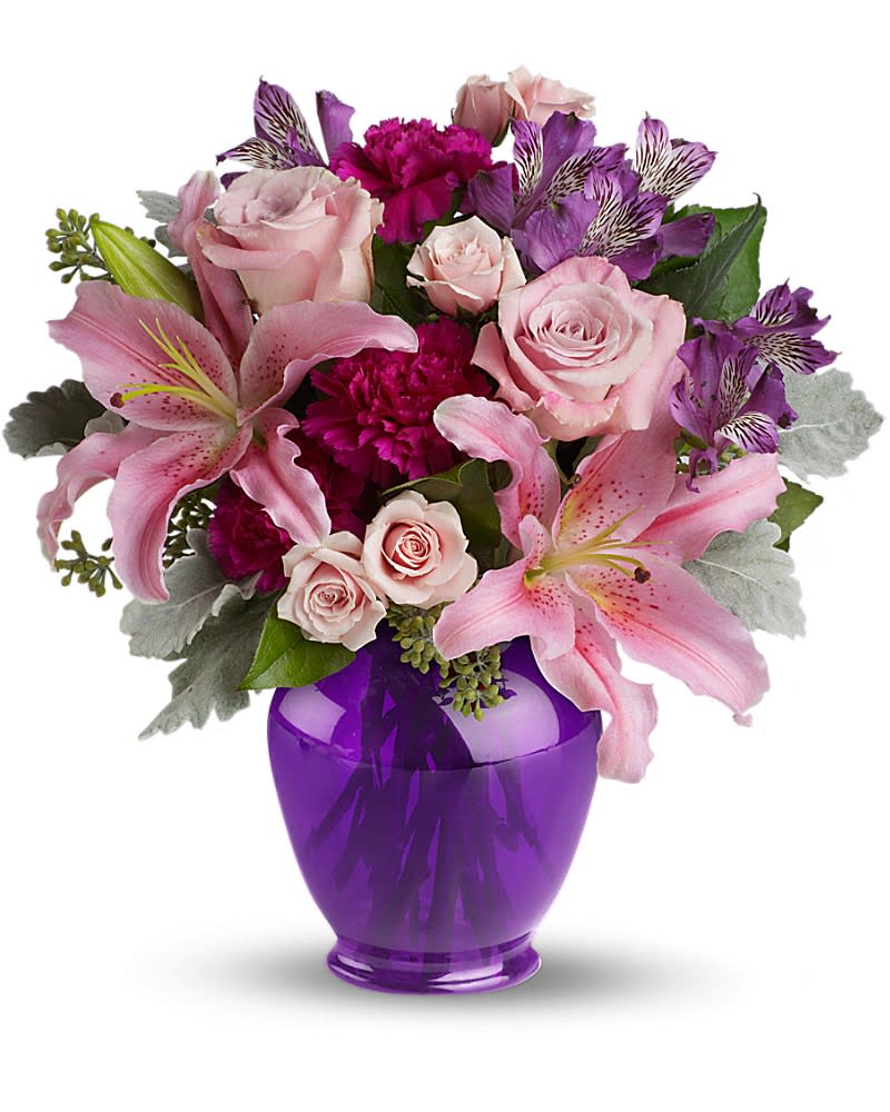 Elegant Beauty - Take their breath away with a spectacular array of pink roses and lilies in a classic ginger jar in deep royal purple. Truly a stunning gift, but without a stunning price tag. The opulent bouquet includes pink roses, light pink spray roses, light pink oriental lilies, purple alstroemeria and fuchsia carnations accented with assorted greenery. Delivered in a deep purple ginger jar.