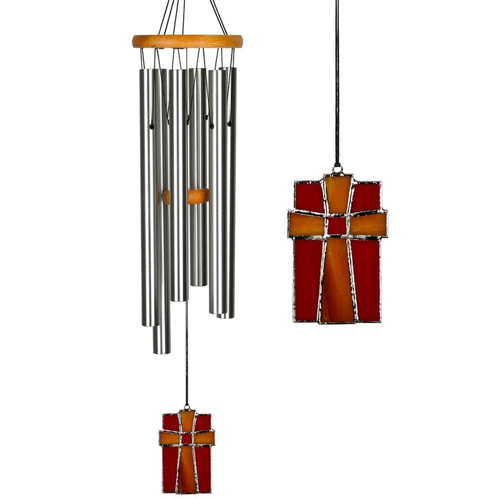 Woodstock Chimes - Amazing Grace Chime - With a unique stained glass feather, this chime looks as good as it sounds!  This chime is tuned to the inspiring tones heard in the opening measures of Amazing Grace, one of America's best loved and most widely known hymns. The lyrics were written by Englishman John Newton in the late 18th century. As a young man on board a merchant ship, Newton underwent a spiritual awakening while caught in a deadly storm at sea. This was the beginning of a journey that would lead the one-time slave trader to become a vocal abolitionist, and transform a man without conviction into one of unshakable faith. It has played an important role in drug and alcohol recovery, the Civil War, the Civil Rights Movement and 9/11. Newton's message of hope and redemption from over 200 years ago resonates with the same power today in our Amazing Grace Chime.  The stained glass windcatcher adds a lovely touch, and is particularly beautiful when the light shines through it. This medium-sized chime carried a mid-range tuning.  'Tis grace has brought me safe thus far, And grace will lead me home. -John Newton  Product Properties Cherry finish ash wood Six silver aluminum tubes Stained glass cross windcatcher Overall Length: 28 inches - Diameter: 5 inches Boxed Weight: 1.5 lb.