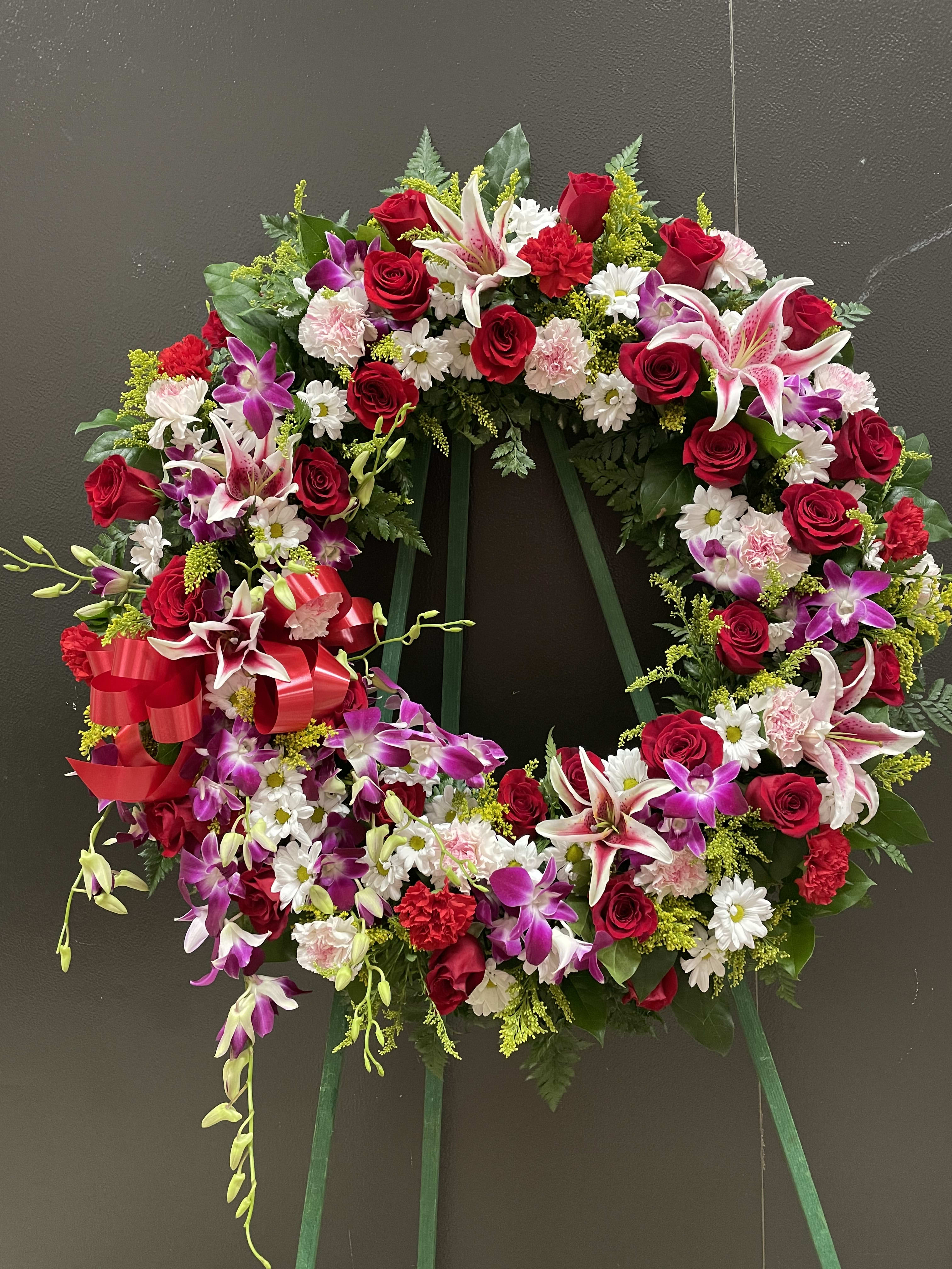 Orchid, Roses and Lilies Wreath (FW17) - This Beautiful wreath made with dendrobium  orchid, red roses and pink lilies . white daisy and greenery .