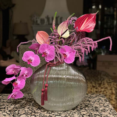 Adriana  - Elegant arrangements with orchids and whimsical tropical flowers. Our designer will create unique and elegant composition. Fine glass or crystal vase will be used to show luxury in minimalistic modern style. Inspired by Japanese ikebana movement, where harmony and balance embrace the present through Floral Art. 