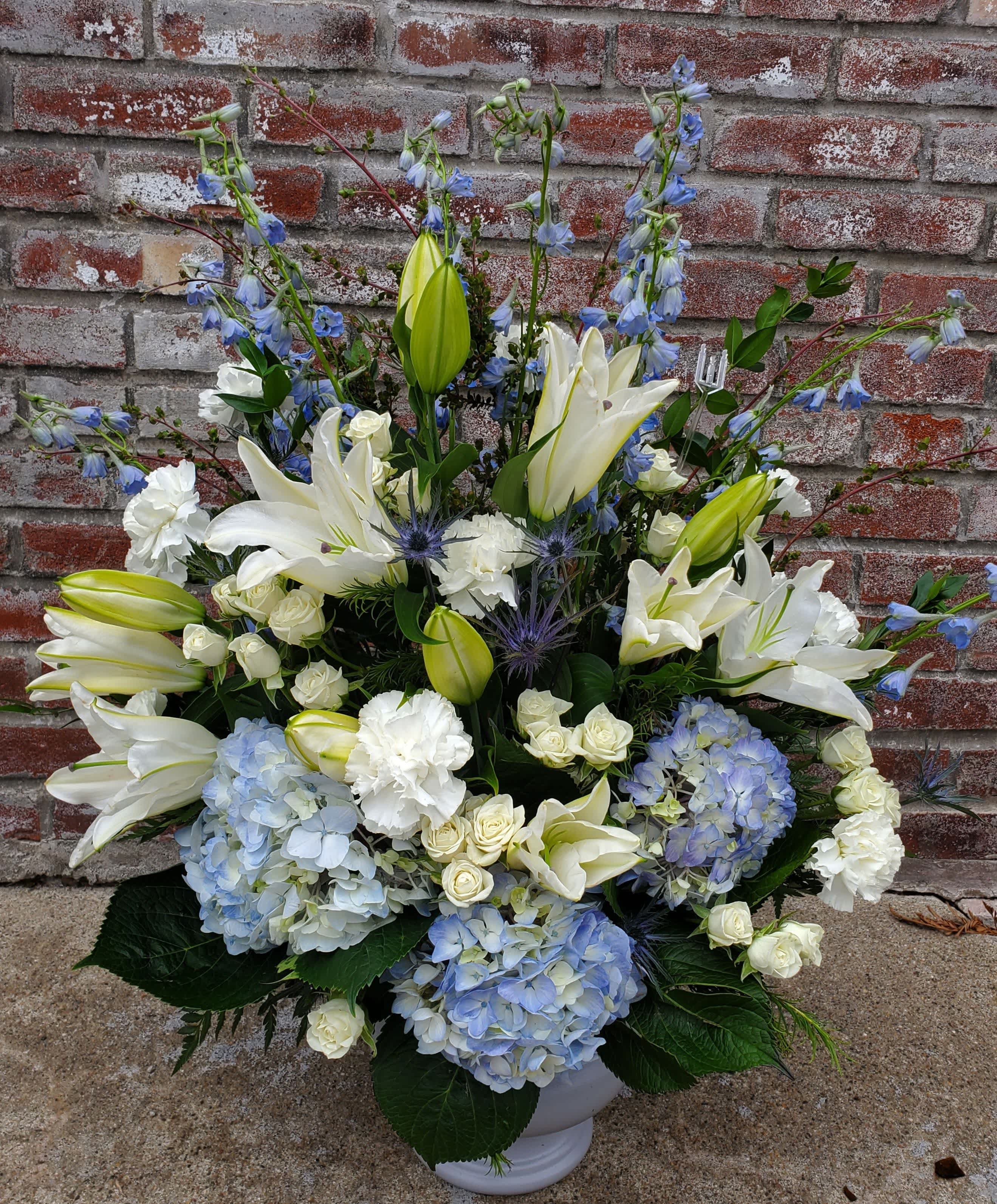 Blue Sky - White lily, blue hydrangea mix makes a perfect sympathy piece for your loved one.