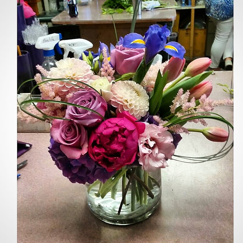 Pop of Purple - The pastel colored roses, dahlias, tulips, and mix of other flowers against the &quot;pop of purple&quot; in the iris and hydrangea, and the burst of hot pink in the peonies,  gives a great contrast of color to draw in your eye... and your heart!  