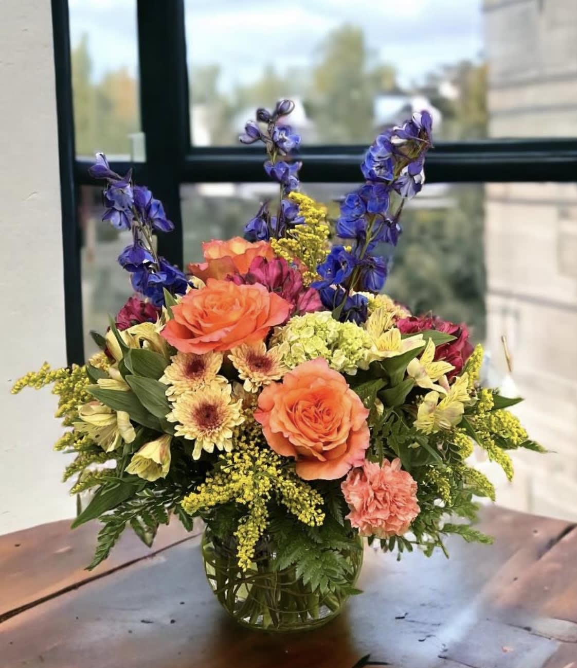 Mary Poppyins - This vibrant arrangement is like a spoon full of sugar for the eyes! Sure to brighten your loved ones day!
