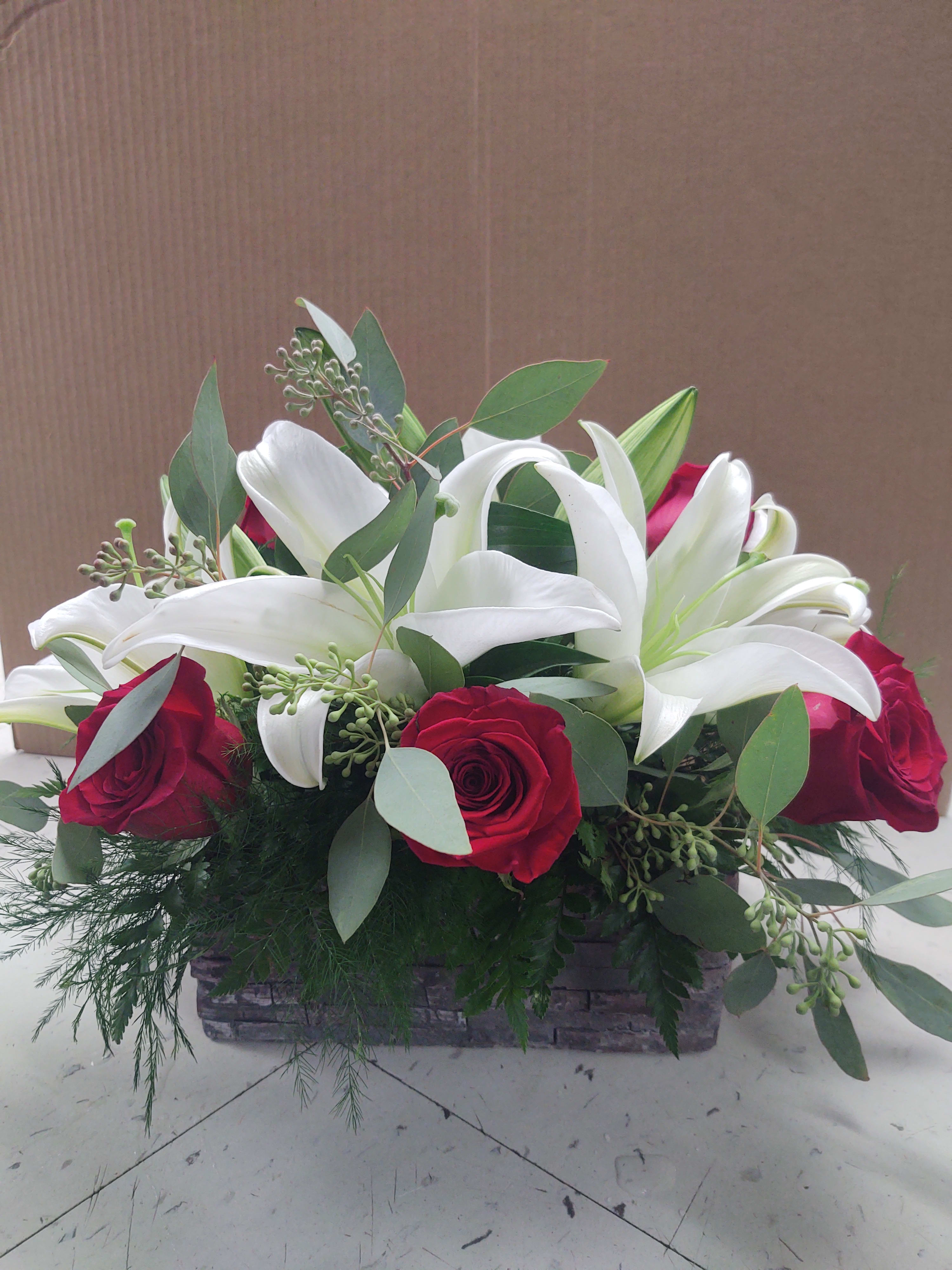Wood grain box of red & white flowers Wood grain box of red & white flowers - Wood grain box of red roses & white lilies