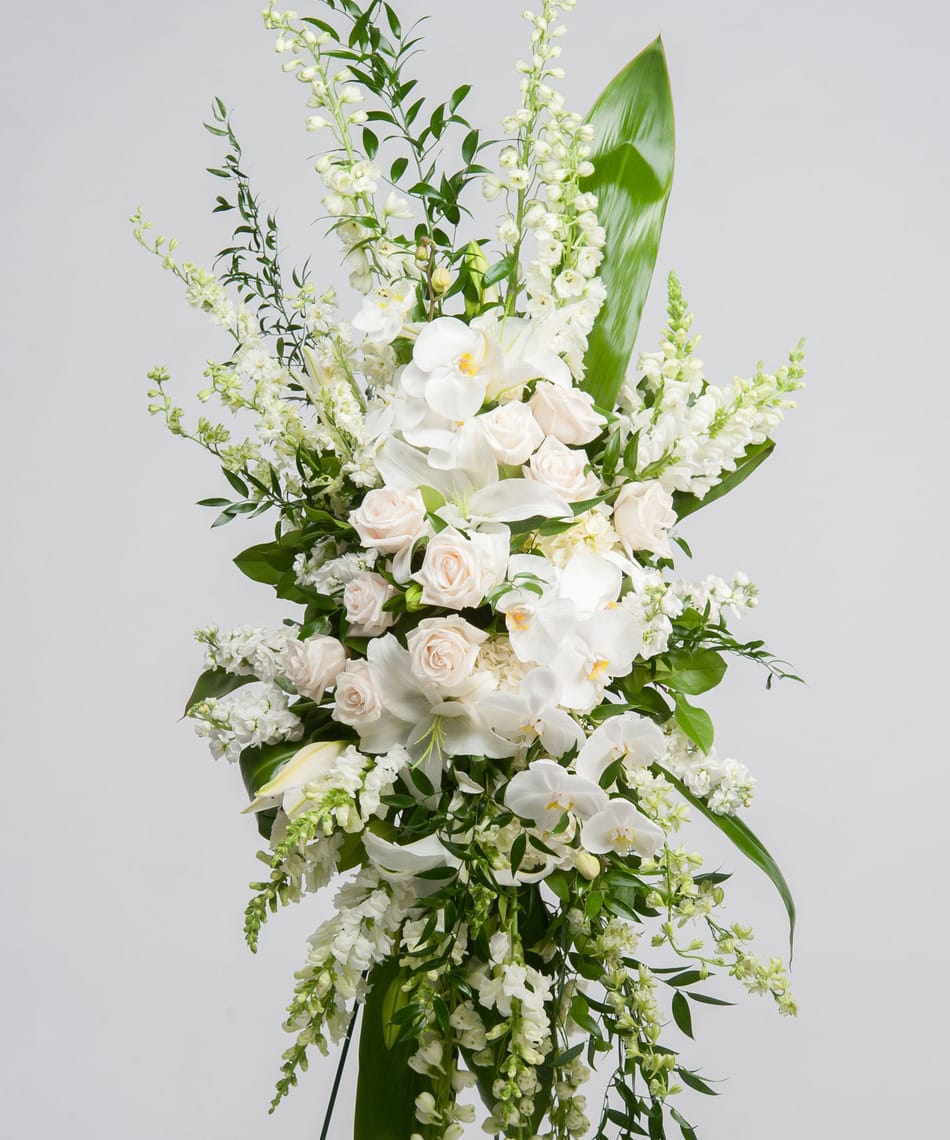 Garden Spray Garden Spray - Snapdragons, roses, orchids, lily, aster and greens standing spray for funeral.
