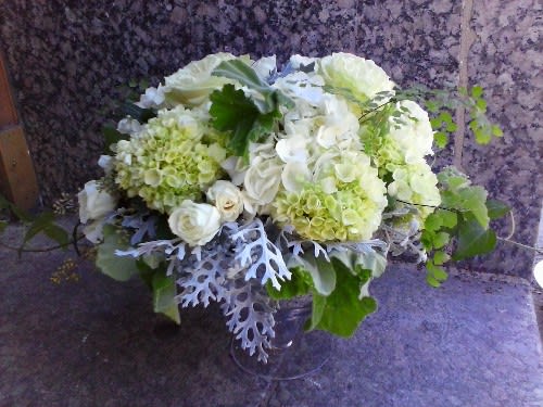 Clean Green Clean Green - Designed in a footed glass vase, this lush, seasonal collection of white and greens, including hydrangeas, roses and various lush foliages.
