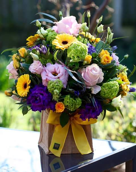 Full and Bloomy Full and Bloomy - Gift someone special this arrangement that is bursting with color and personality.