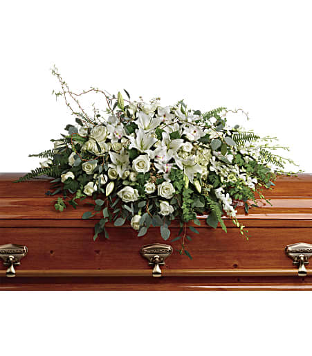 Grandest Glory Casket Spray - As serene as gently falling snow, this pure white spray of hydrangea, orchids, roses and lilies is a heartfelt symbol of peace and beauty--a symbol that will remain a guiding light to your loved ones for years to come. This stunning spray features white hydrangea, white cymbidium orchids, white dendrobium orchids, white roses, white spray roses, white oriental lilies, curly willow, green ivy, parvifolia eucalyptus, seeded eucalyptus, silver dollar eucalyptus, sword fern, and lemon leaf. Approximately 48 1/2&quot; W x 33&quot; H 