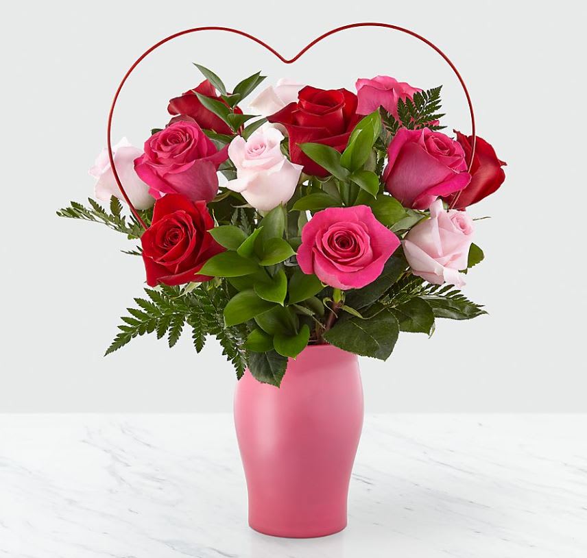 XOXO Rose Bouquet (Will include heart pick in pink vase as wire heart is sold out) - Make her fall head over heels in love with our XOXO Rose Bouquet. We've elevated your simply sweet pink and red rose bouquet of 12, 18 or 24 roses. With such a unique touch added to a classic bouquet, you can't go wrong with this arrangement. vase may vary.  