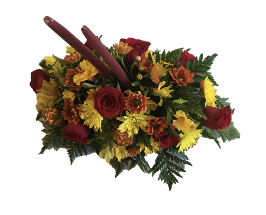 Autumn Centerpiece - This gorgeous Autumn centerpiece features fresh red roses, yellow and butterscotch daisies, yellow alstroemerias, and foliage adorned with two taper candles. 