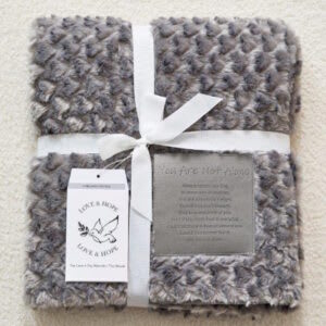 You Are Not Alone Patch Fur lined Sympathy Throw You Are Not Alone Patch Fur lined Sympathy Throw - Patch fur throw 60" long 50" wide grey in color.   Patch reads:  "Always remember that, in some way or another, you are somebodys angel. Even if you don't know it, they love and think of you. Even if you don't hear it everyday, trust that there is love all around you. Even if you cannot feel it, you are not alone."