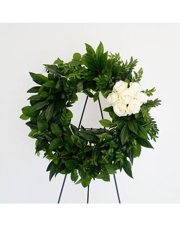 Forever Wreath - This stunning and elegant wreath is comprised of a gorgeous mix of greenery with a splash of white roses.