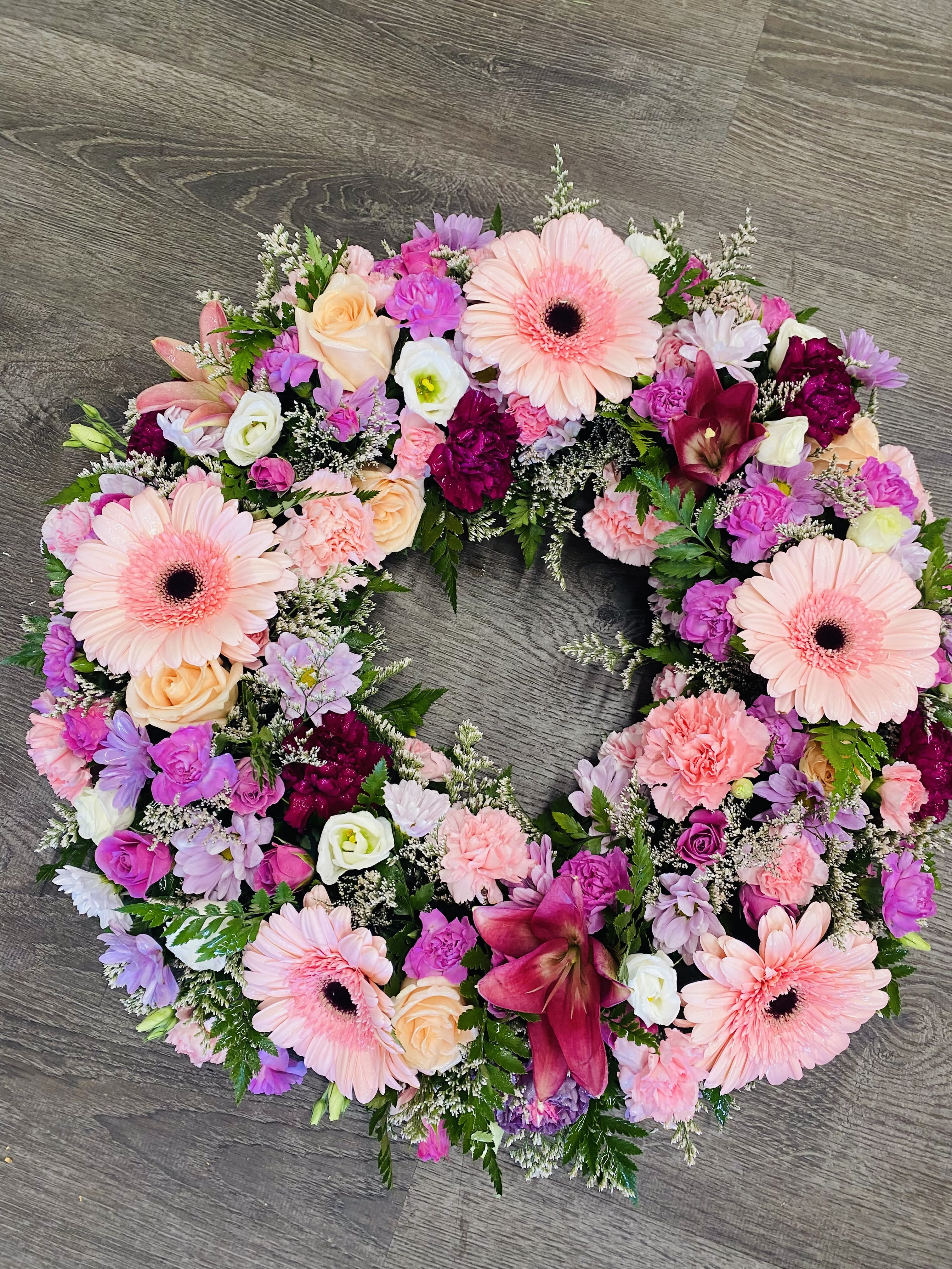 Sleep in Peace Wreath - This wreath features shades of pink &amp; lavenders.  Measures approximately 22 inches across. A ribbon and script can be added to this piece.
