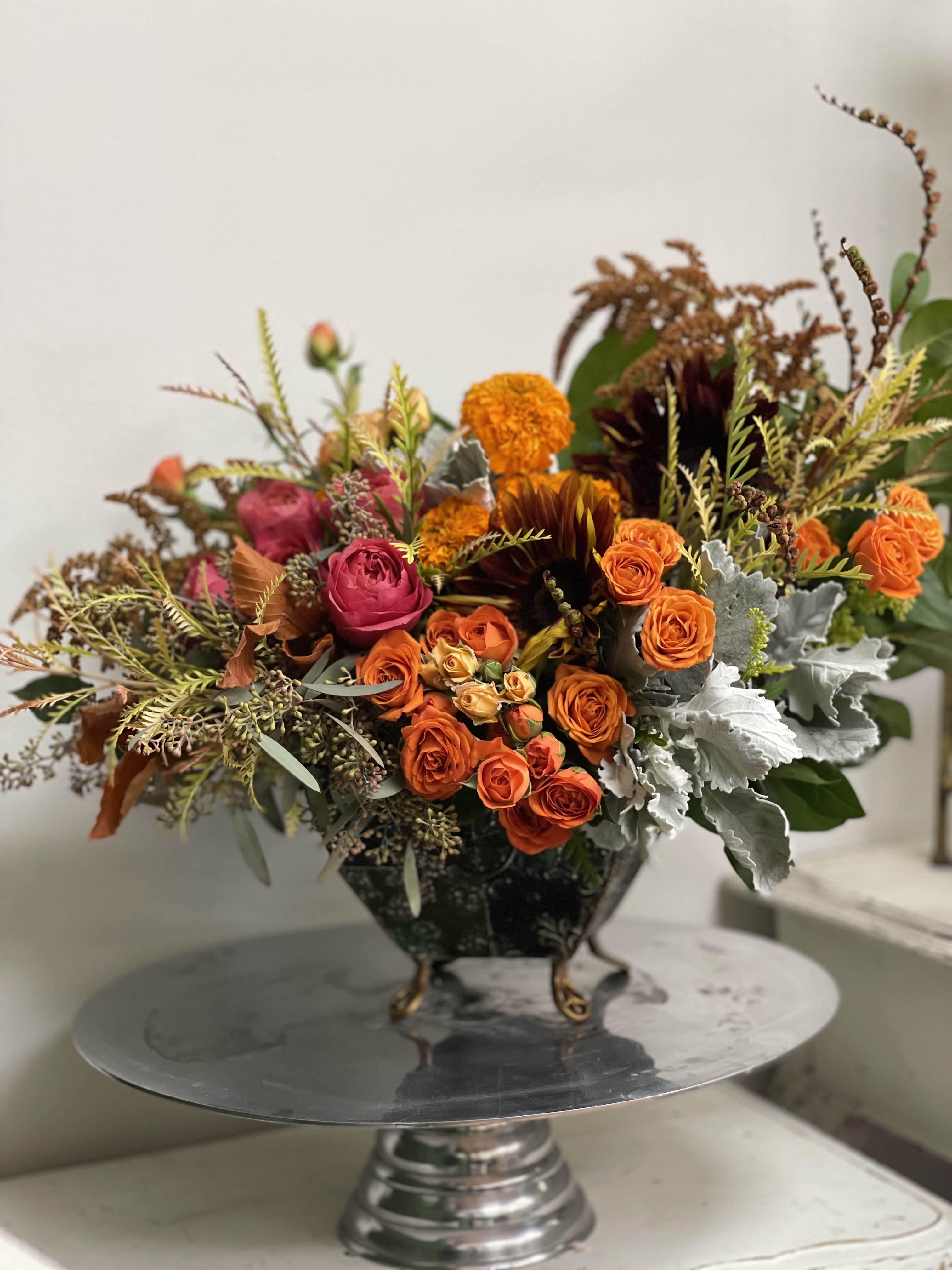 Orange Blossom Orange Blossom - Beautiful combination of oranges and browns arranged in rustic vase. Great gift for any occasion.