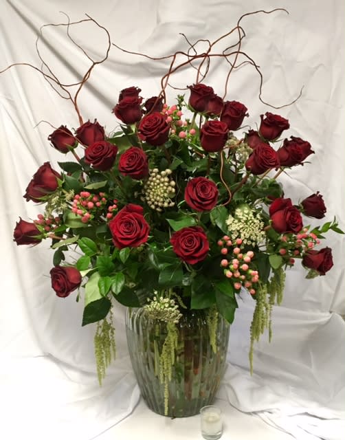 The Grand Gesture - When only the very best will do! This premium arrangement features four dozen of the finest long stemmed red roses, accented with amaranthus, hypericum and more. approx. 40&quot; tall and 30&quot; wide