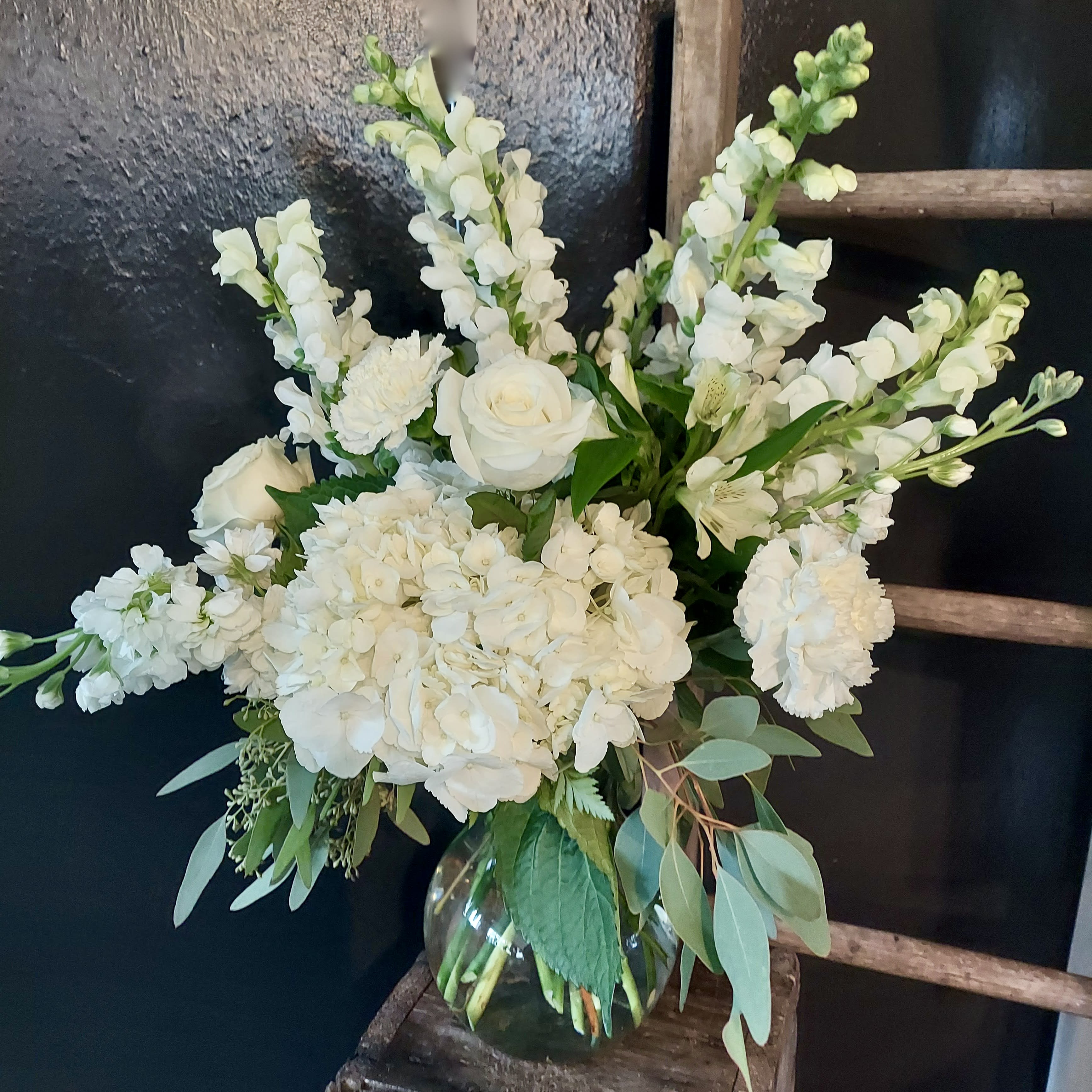 Wild About White Wild About White - A dazzling display of the finest floral whites highlighted by sage greens and lots of fun textures. This Sunnyside Specialty is a delightful gift for ANY occasion.