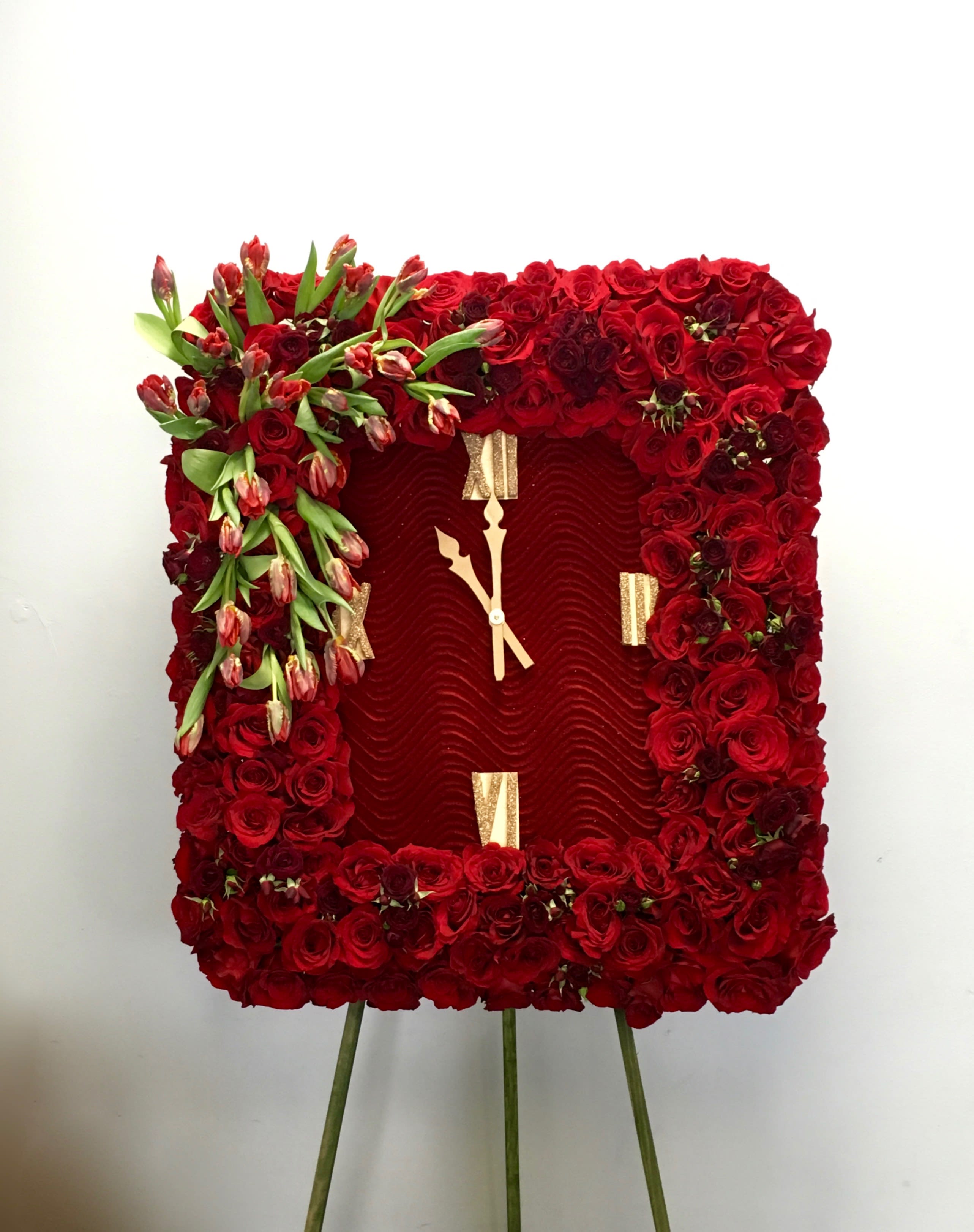 Red Tulips and Roses Frame  - Covered in red roses, this sympathy wreath also contains an accent of tulips in the upper corner. Frames are approximately 32 inches wide.  
