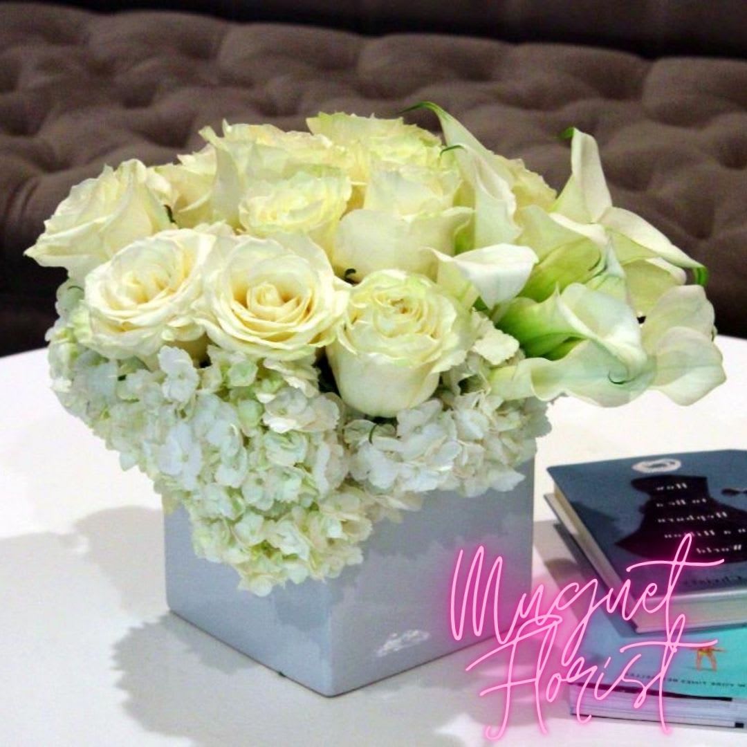 Isle of Elegant White Rose Arrangements: A Tranquil Haven of Grace and Purity - Step into a realm of serene elegance and pure beauty with the &quot;Isle of Elegant White Rose Arrangements.&quot; This collection of meticulously curated white rose arrangements is a tribute to the timeless allure of white roses and their ability to create an atmosphere of tranquility and refinement. Like an enchanting isle adorned with these pristine blooms, this arrangement embodies the essence of grace and purity.  &quot;Varieties and colors of flowers may vary according to season and availability.&quot;  This arrangement includes a newly cleaned vase and good quality water &amp; flower food.  Item: 116  Care Instructions: For the best vase life, change the water every two days.