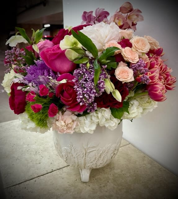 Eternal Embrace: The 'Always and Forever' Mix Flower Arrangement - Embark on a journey through time and sentiment with the &quot;Eternal Embrace: Always and Forever&quot; mix flower arrangement. This arrangement weaves together an exquisite blend of blooms that transcend the boundaries of time, representing an unbreakable bond that lasts &quot;always and forever.&quot; With a harmonious mix of flowers that symbolize enduring love and timeless beauty, this arrangement captures the essence of a love story that knows no end.  Varieties and colors of flowers may vary according to season and availability his arrangement comes with a newly cleaned vase and good quality water &amp; flower food.  Item: 527  Care Instructions: For the best vase life, change the water every two days.