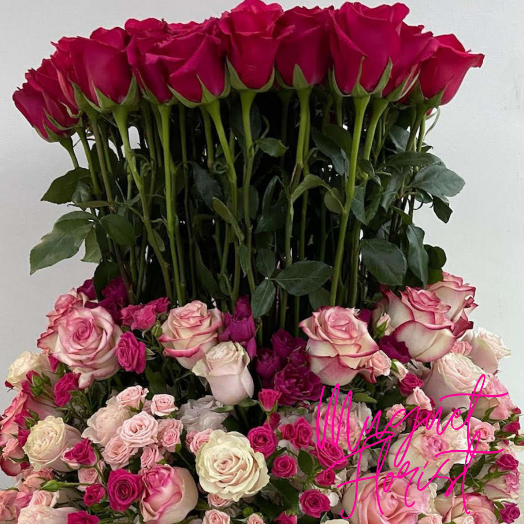 Enchanted Castle Bouquet: A Sweet Pink Symphony of Roses and Hydrangeas - Love Castle Bouquet  - Immerse yourself in the romance of an enchanted fairytale with the &quot;Enchanted Castle Bouquet.&quot; This captivating arrangement celebrates the delicate allure of sweet pink florals, featuring the timeless elegance of roses and the lush beauty of hydrangeas. As if plucked from the gardens of a dreamy castle, this bouquet weaves a tale of love and enchantment through its soft hues and captivating blooms.  Love Castle Bouquet. Magnificent in size and bursting with pure romance, this impressive castle bouquet design features sweet pink florals, including roses and hydrangeas.l Overall stands at approximately 34&quot; tall overall.  Please Note: This arrangement requires 24 to 48 hours to be completed. Contact us for more information and color choices.  Varieties and colors of flowers may vary according to season and availability.  Item: 155b