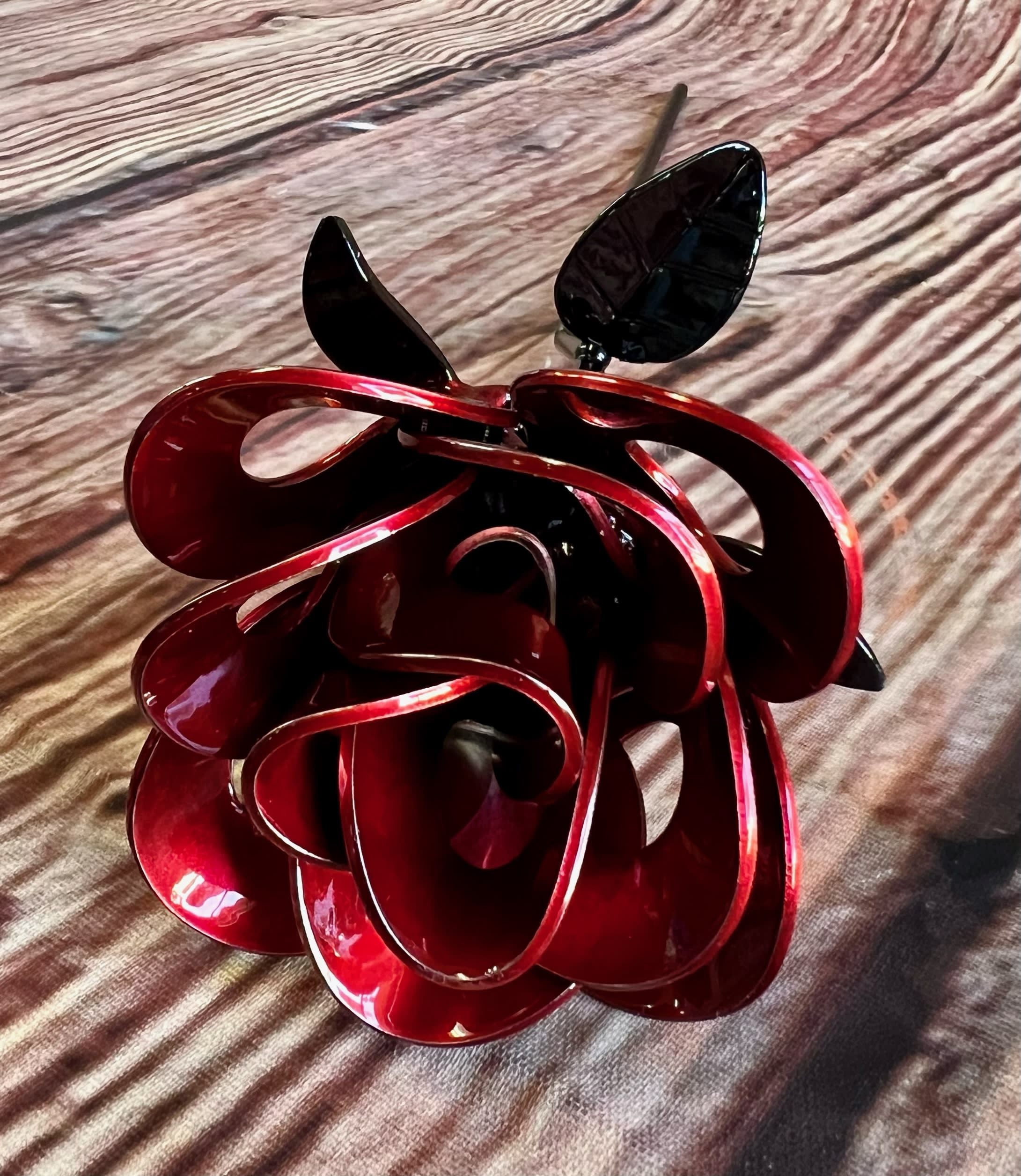 Immortal rose - Immortal metal roses are the perfect gift for the important one in your life. These artfully sculpted roses are crafted by bending, cutting and welding stainless steel washers. Every rose is unique and made from recycled materials.  12&quot; and powder-coated for an ever lasting shine and individually packaged. The rose color is a lustrous red with a flat matte black stem and leaf. Please specify color desired in special instructions. Available in 3 colors -metal and red &amp; black.