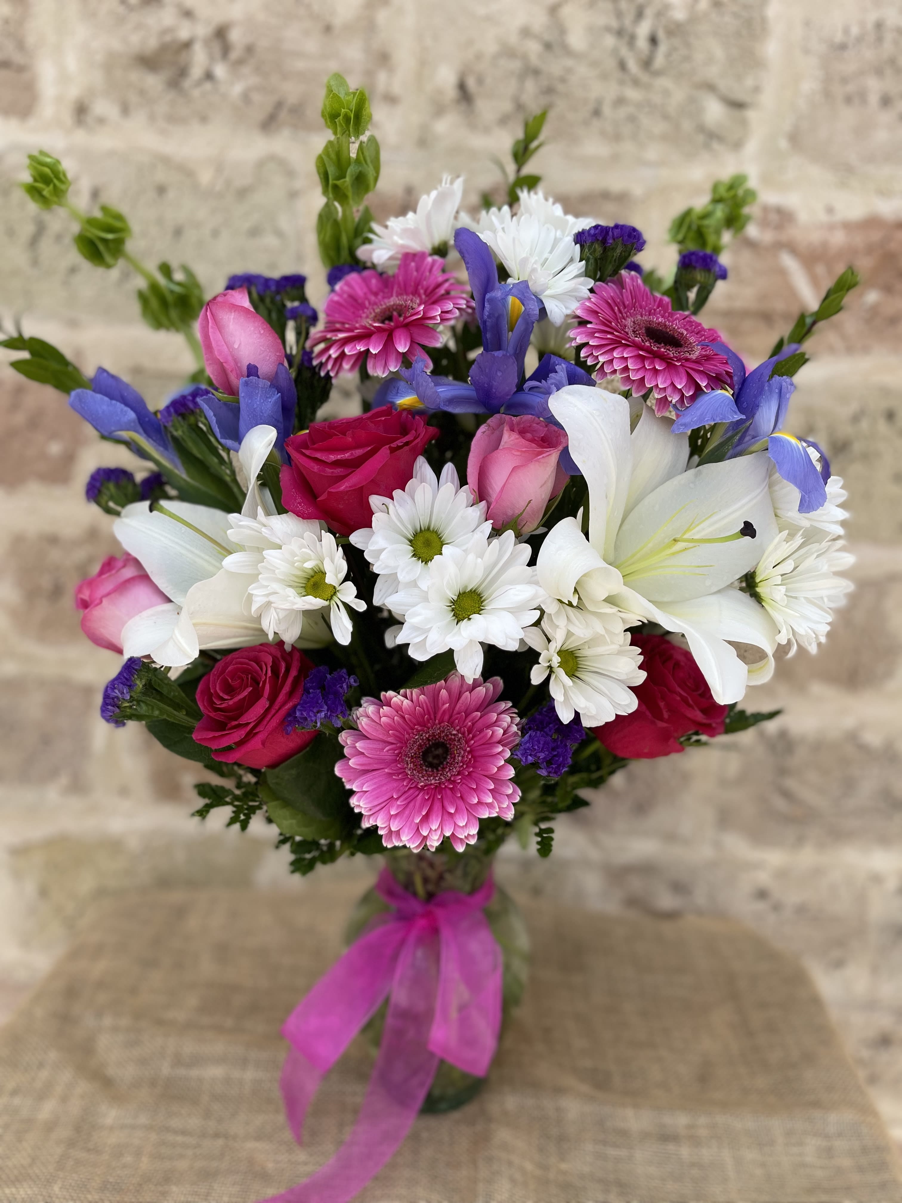 Dearest Treasure  - Our dearest treasures are the ones we hold closest to our hearts. This is a special arrangement filled with lovely roses, gerberas, lilies and more.  