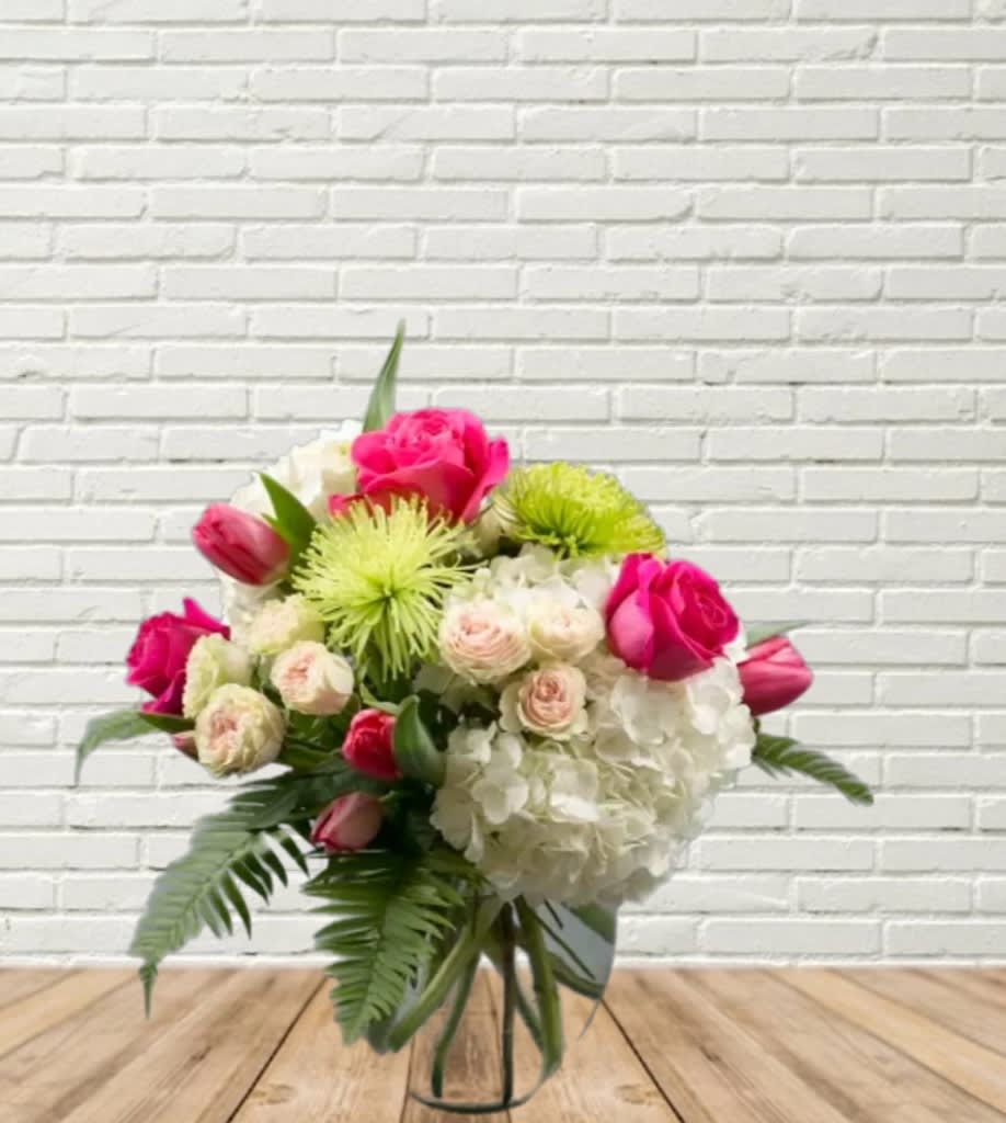 If You Really Love Me If You Really Love Me - Compactly designed mix of hydrangea, roses, spray roses, mums and tulips in a clear glass oval vase. If ordered out of season or specific color is not available we will make appropriate substitutions.