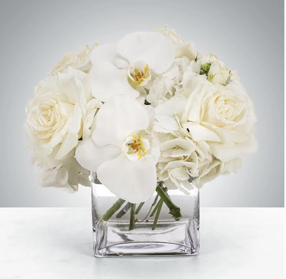 Linen by BloomNation™ Linen by BloomNation™ - This petite all-white arrangement featuring hydrangea and orchids is the perfect all-occasion gift. Send it for any holiday, event, or circumstance. Approximate Dimensions: 8"D x 8"H