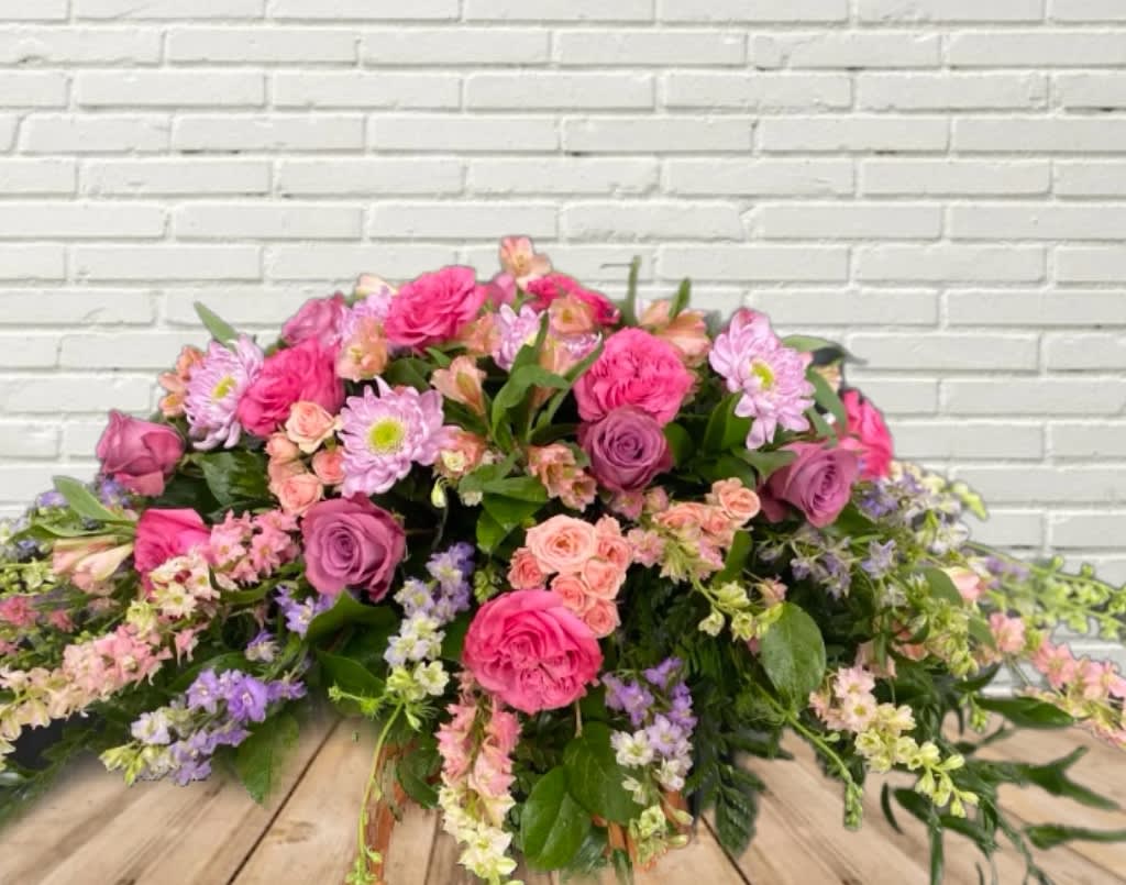 Pastel Beauty Casket Spray Pastel Beauty Casket Spray - Pastel Beauty with a focus of roses, larkspur, spray roses, alstroemeria, and spray roses.